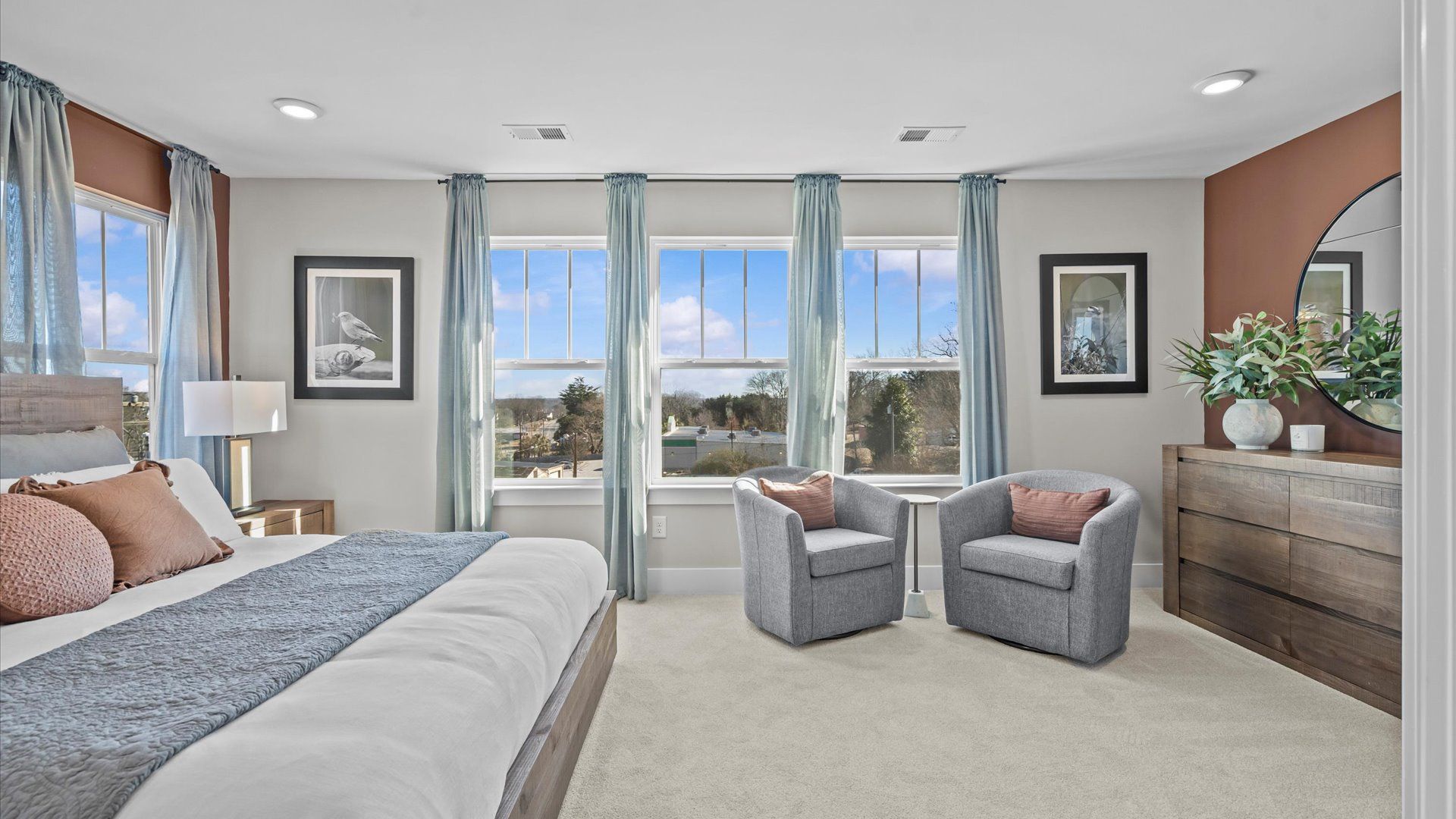 Cozy family room with elevated ceilings in two story townhome at Saluda Crossing by DRB Homes in Piedmont, SC