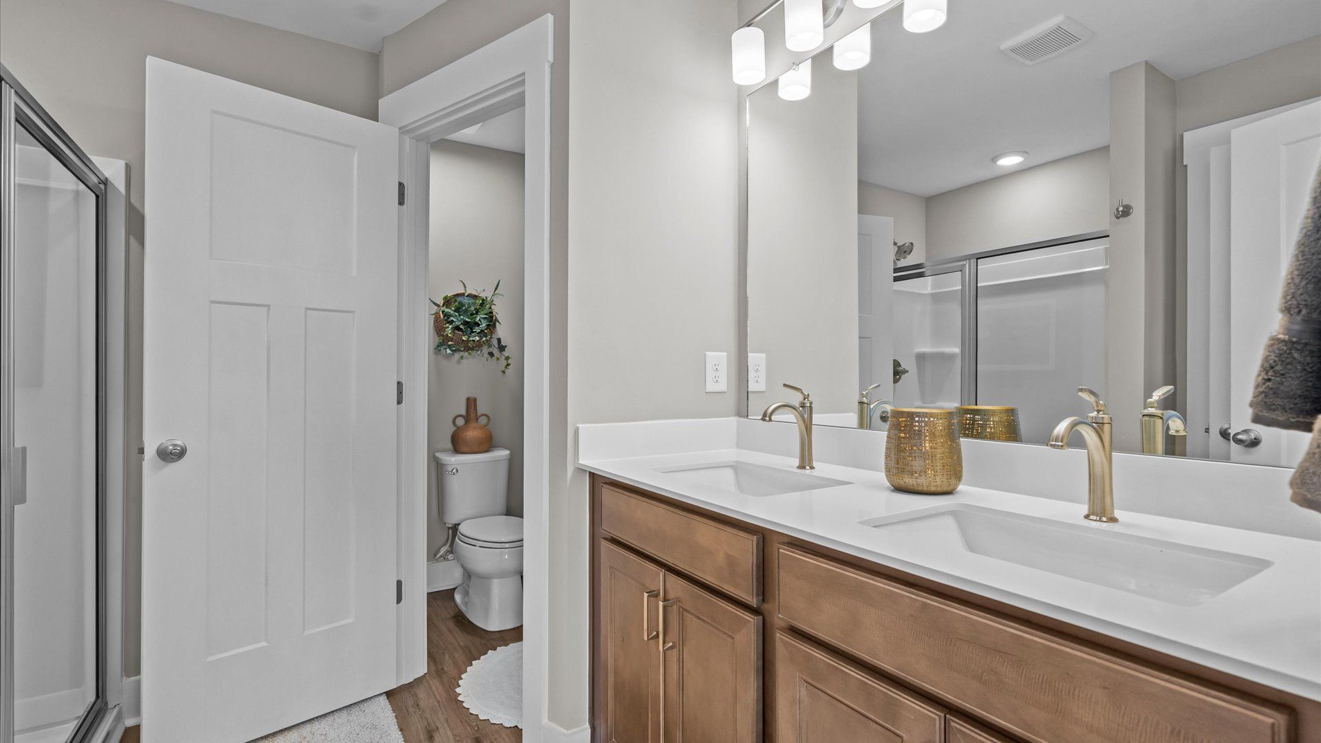 Spa-like primary bathroom with double sink vanity in two story townhome at Saluda Crossing by DRB Homes in Piedmont, SC