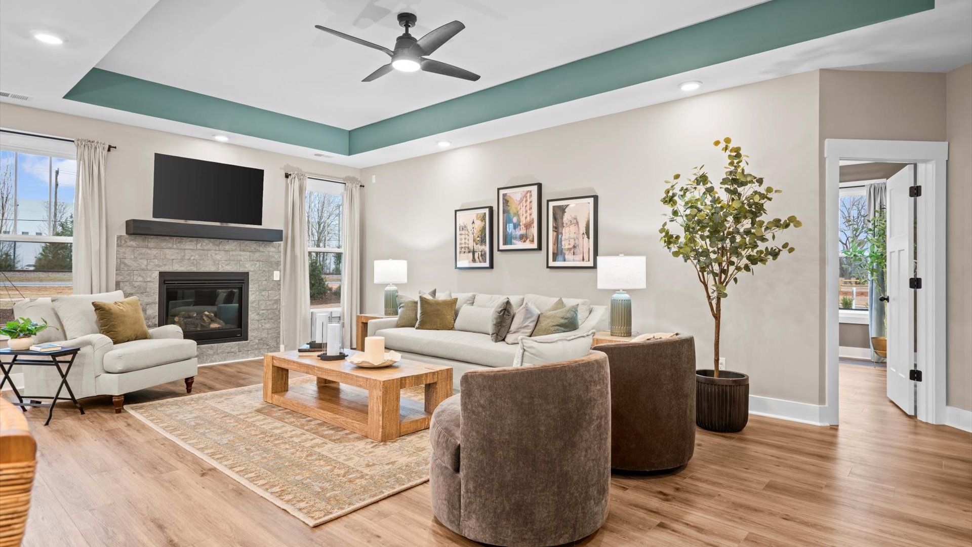 Memorable moments begin in this elegant, open family room with hardwood flooring and refined finishes in Spartanburg, SC