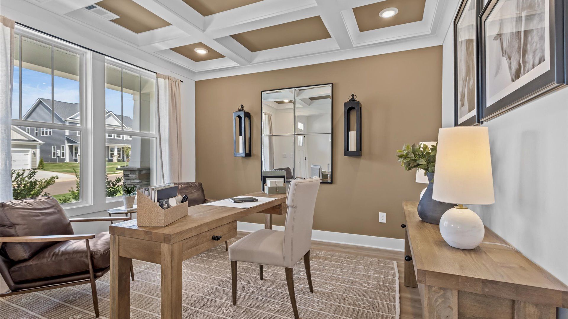 Vibrant natural light, coffered ceiling, and tasteful design define this study near the front of the home at Easler Farm