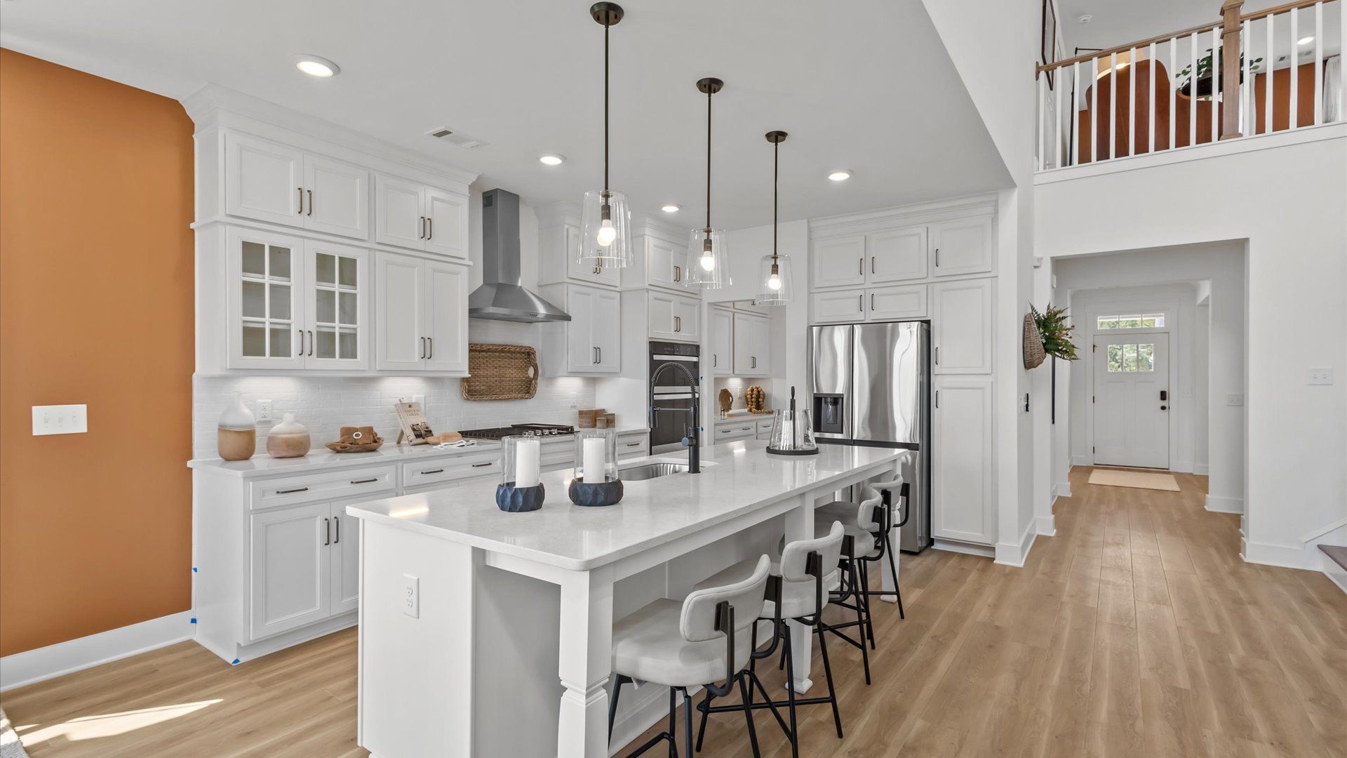 Notable kitchen space with elegant pendant lighting and a large island perfect for entertaining at Easler Farm