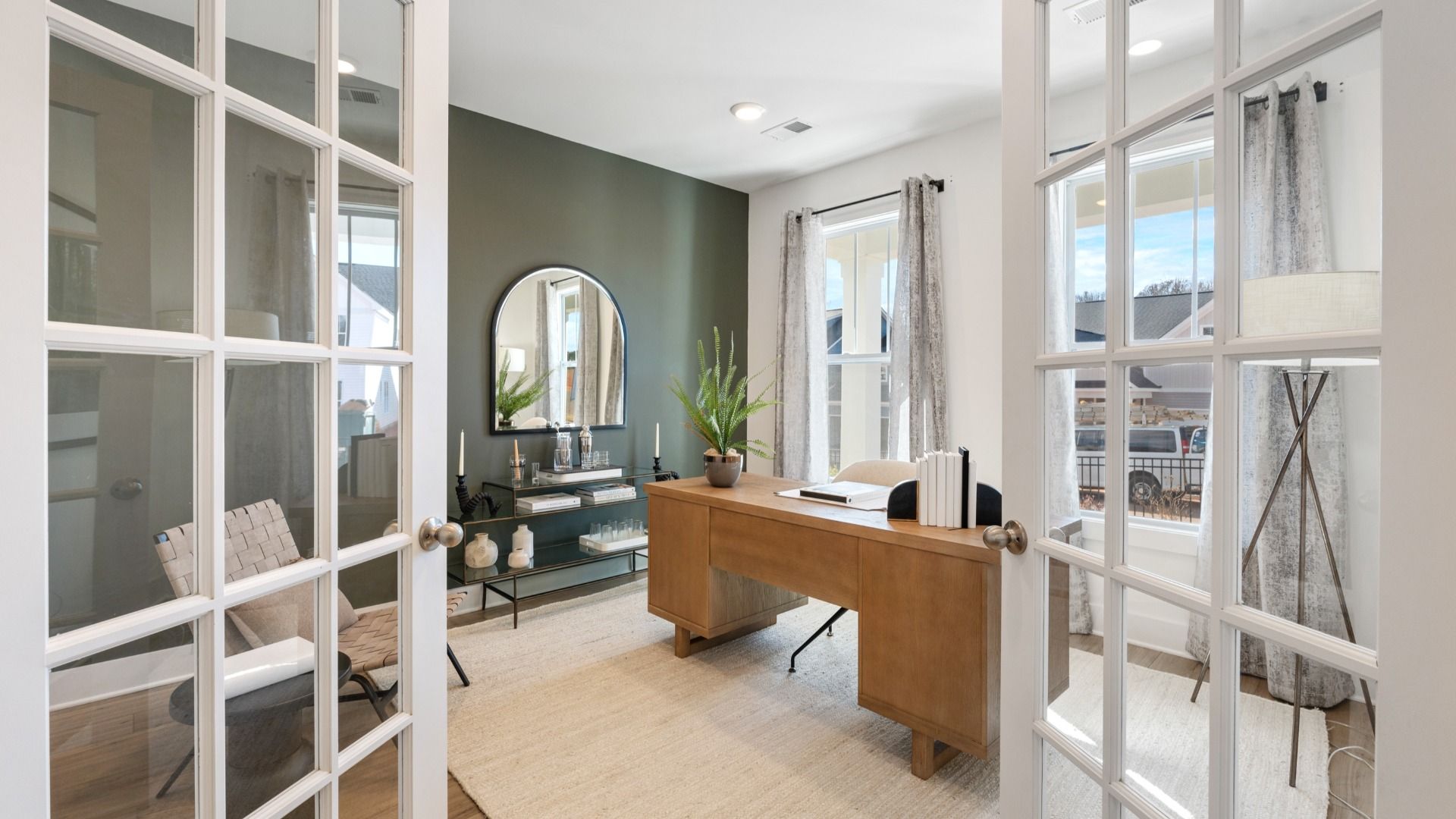 First-class home office behind elegant French doors—designed with high standards in mind at the new Easler Farm community