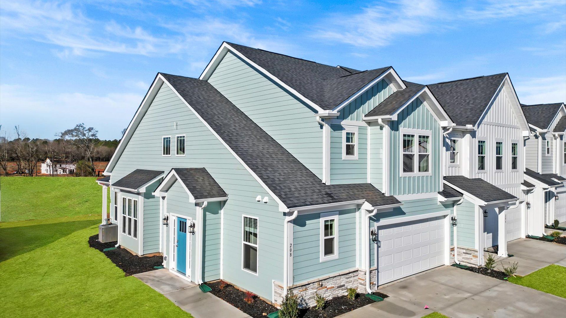 Refined exterior design with balanced architectural detail in this distinguished two-story villa at Barton Hollow