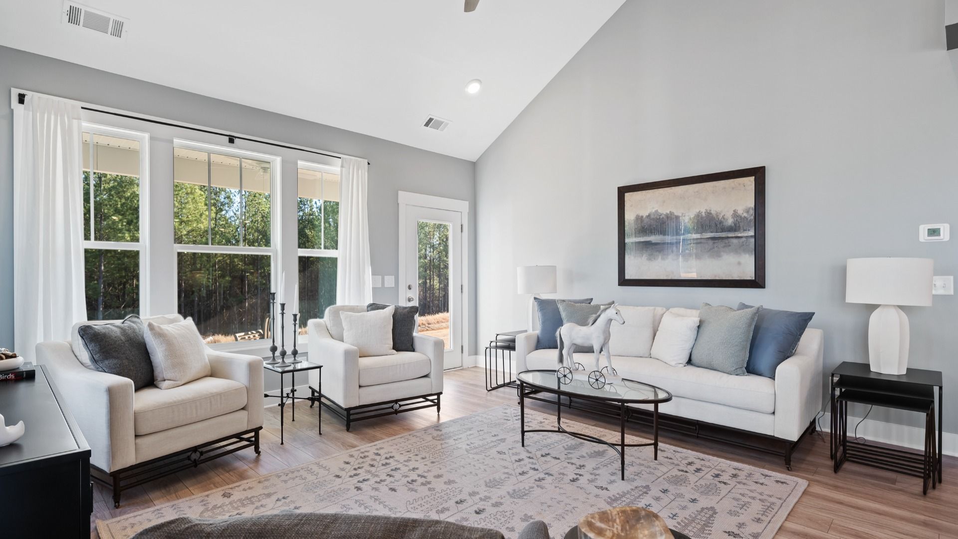 Highly skilled craftsmanship and modern elegance meet in this family room with soaring ceilings