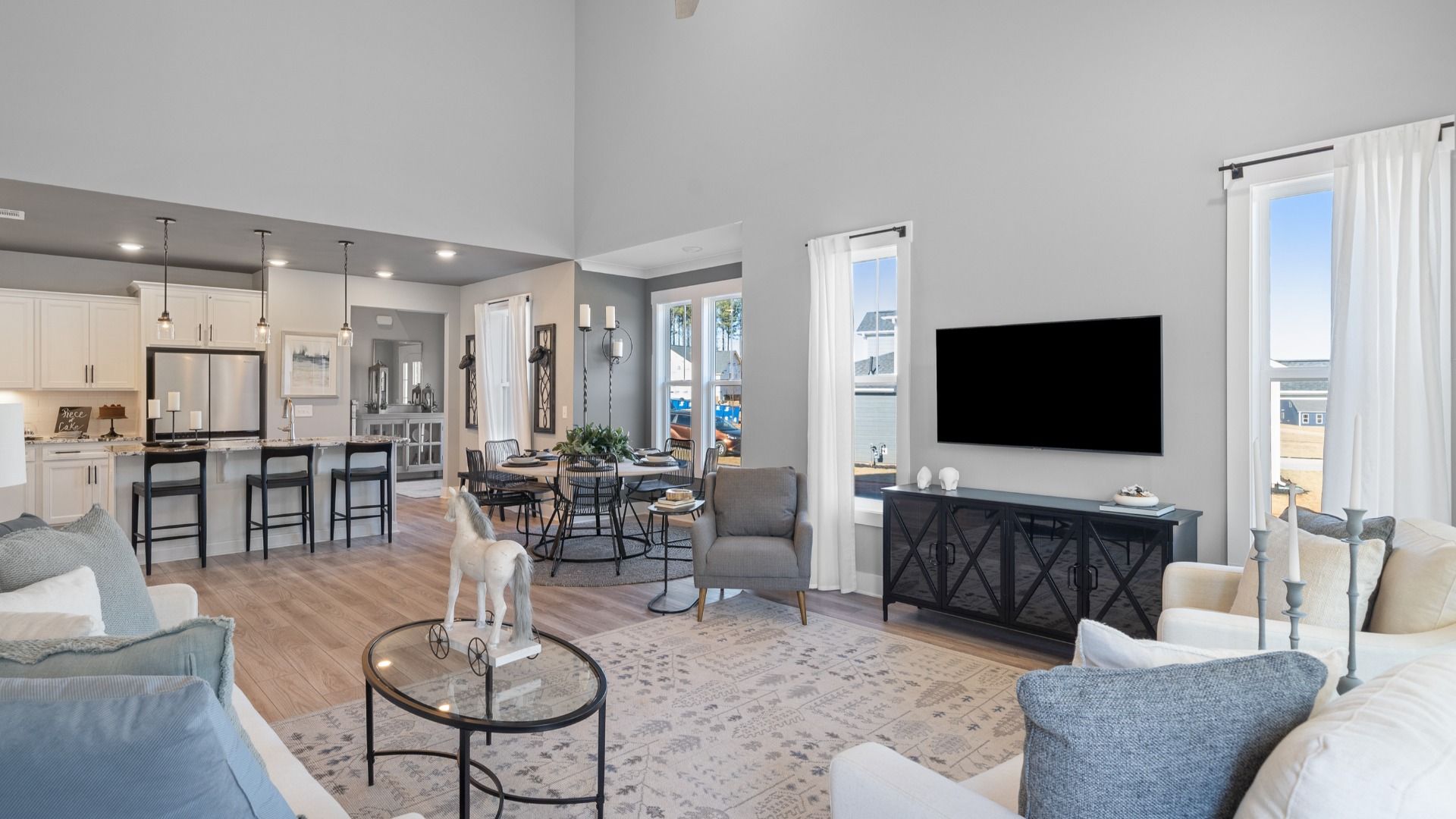 Comfortable living space with abundant natural light and seamless flow located at Barton Hollow near Downtown Fountain Inn