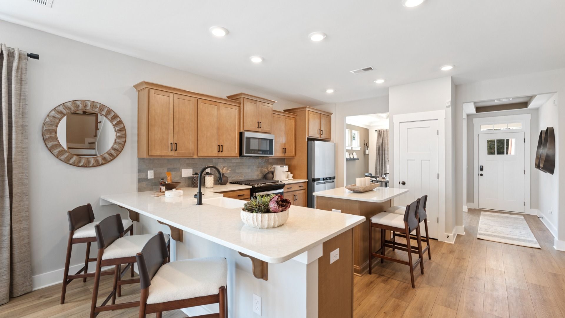 Beautifully appointed kitchen with spacious counters and sophisticated detailing at the new Barton Hollow community