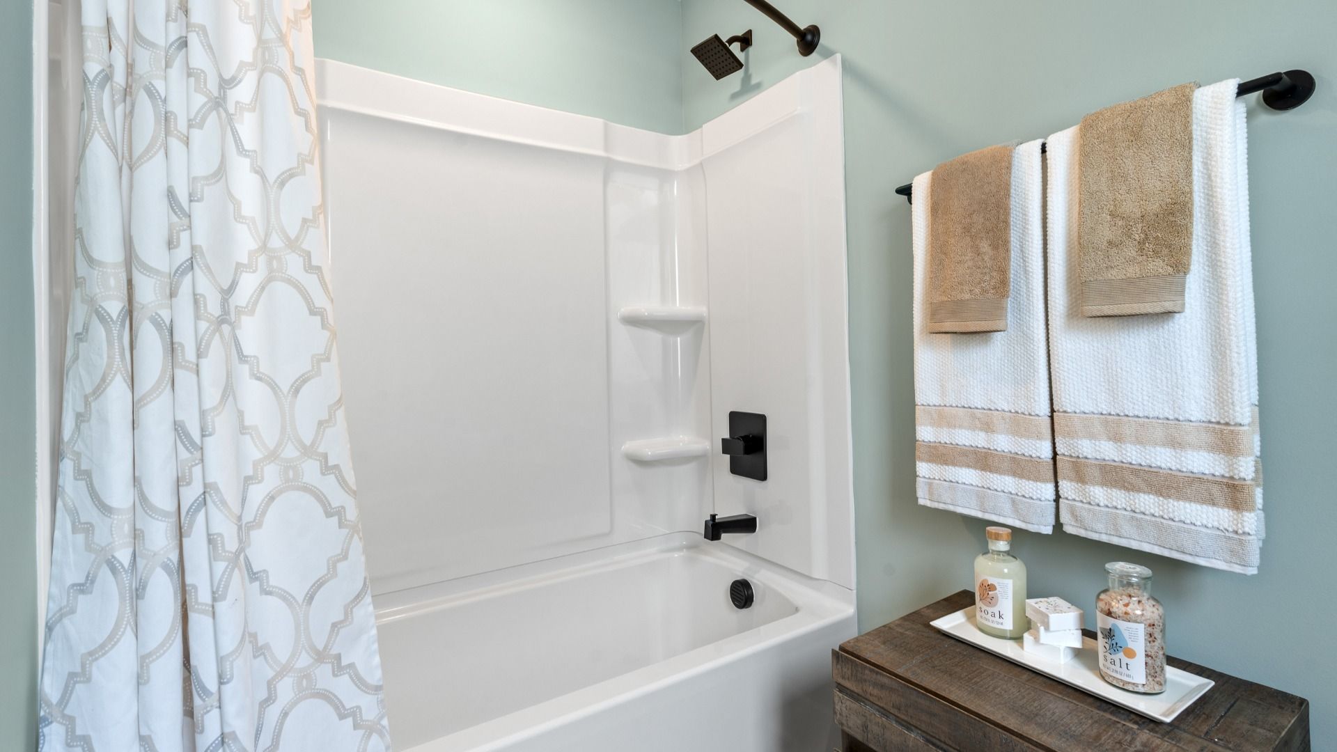Classic tub and shower combination with refined tile surround in this secondary bathroom at Barton Hollow