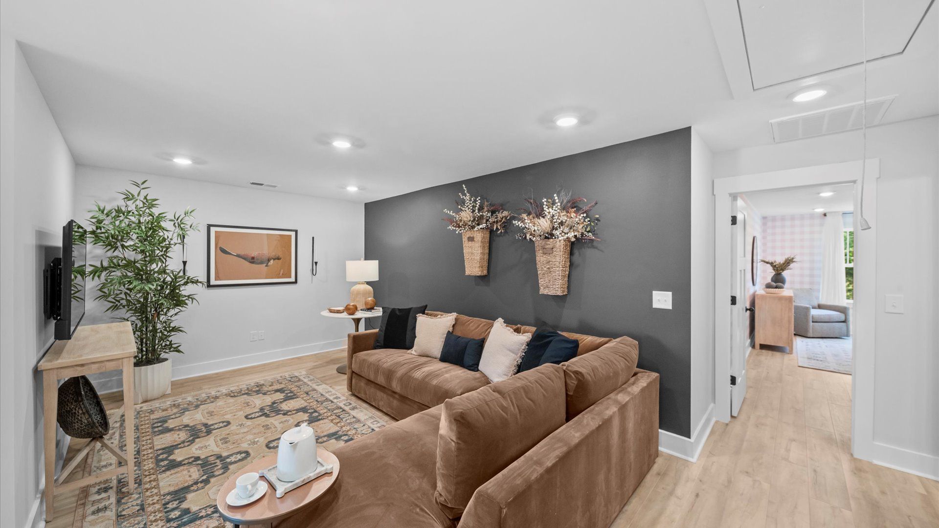 Hardwood flooring enhances the versatility of this elegant upper-level loft space in Fountain Inn, SC