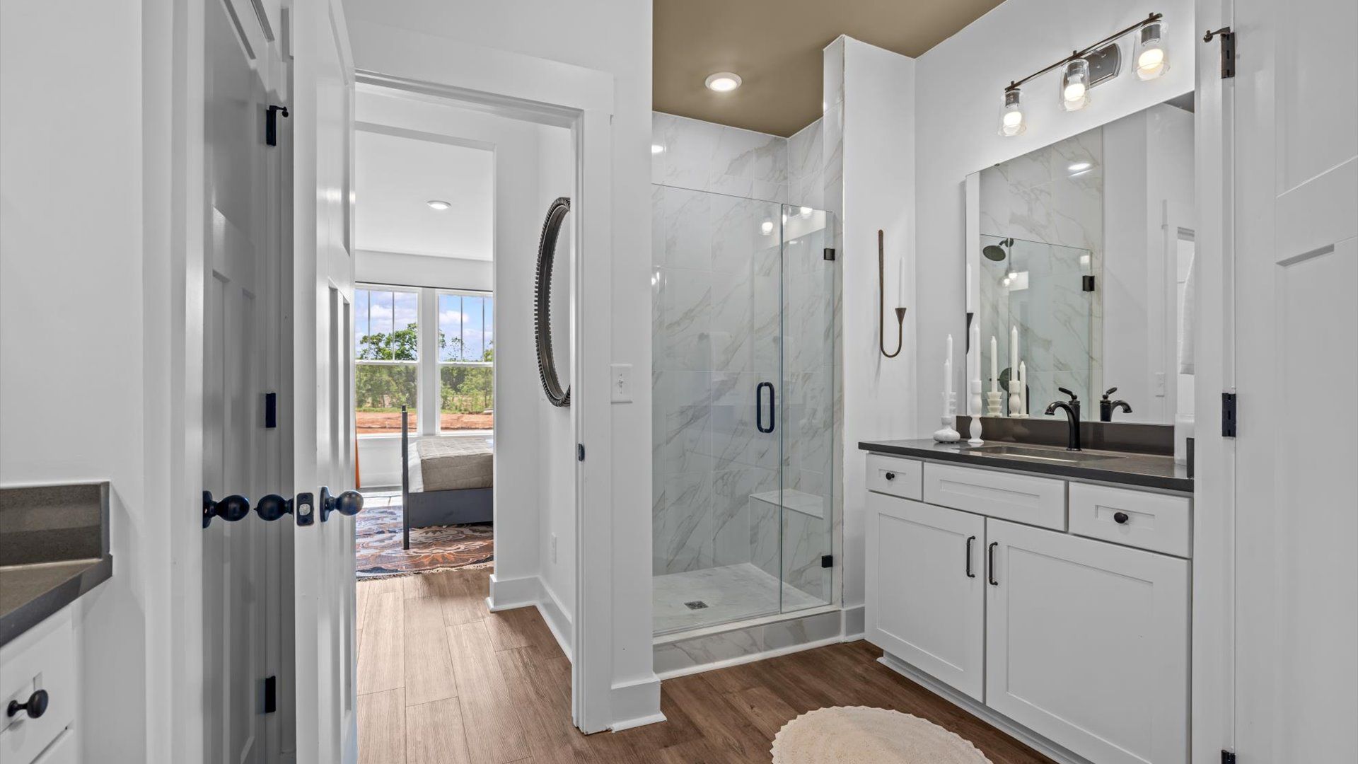 Highly functional and elegant en-suite with a tiled walk-in shower and refined finishes at Barton Hollow