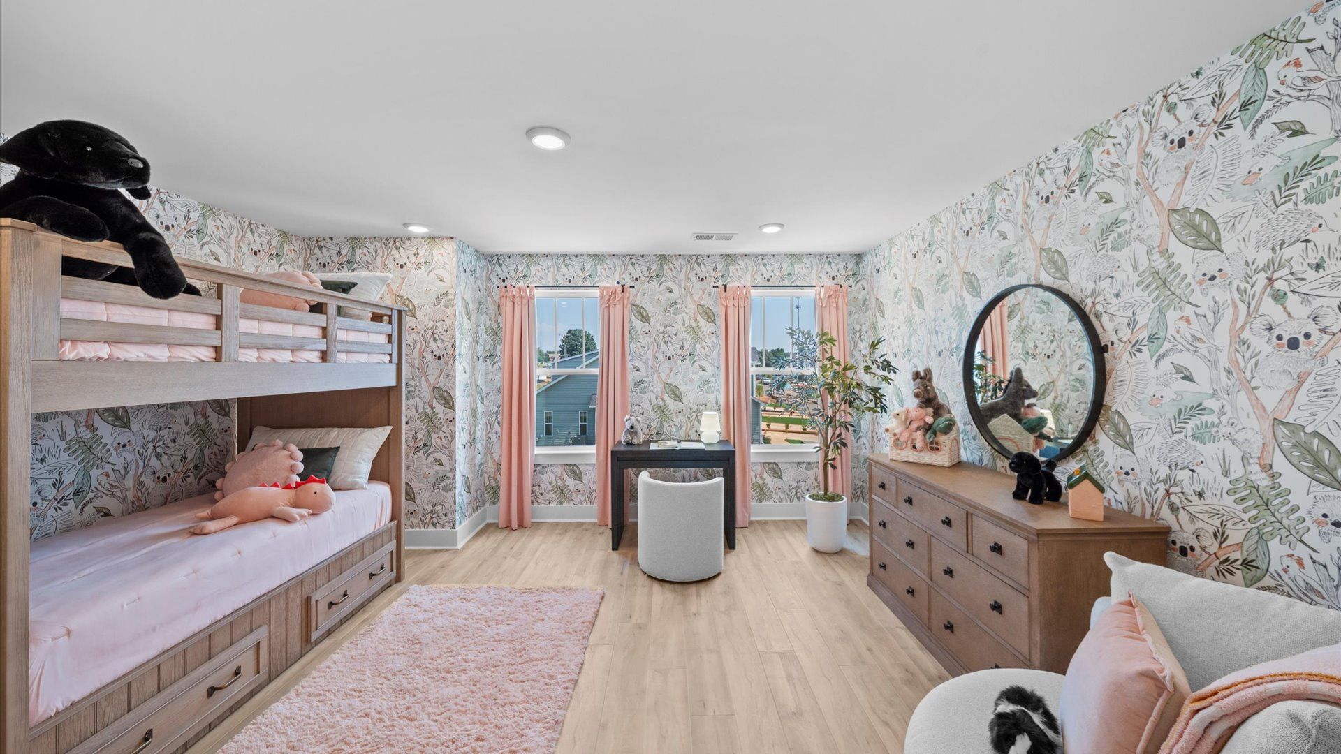 Thoughtfully designed secondary bedroom featuring hardwood flooring and tasteful detail at Barton Hollow
