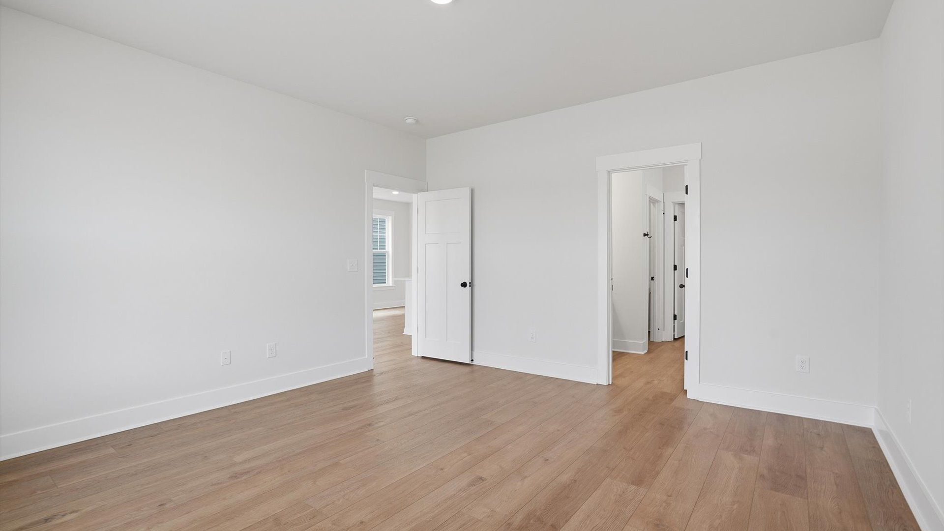 Eye-catching details and elegant finishes in the vibrant primary suite of this select home at Harrier Point