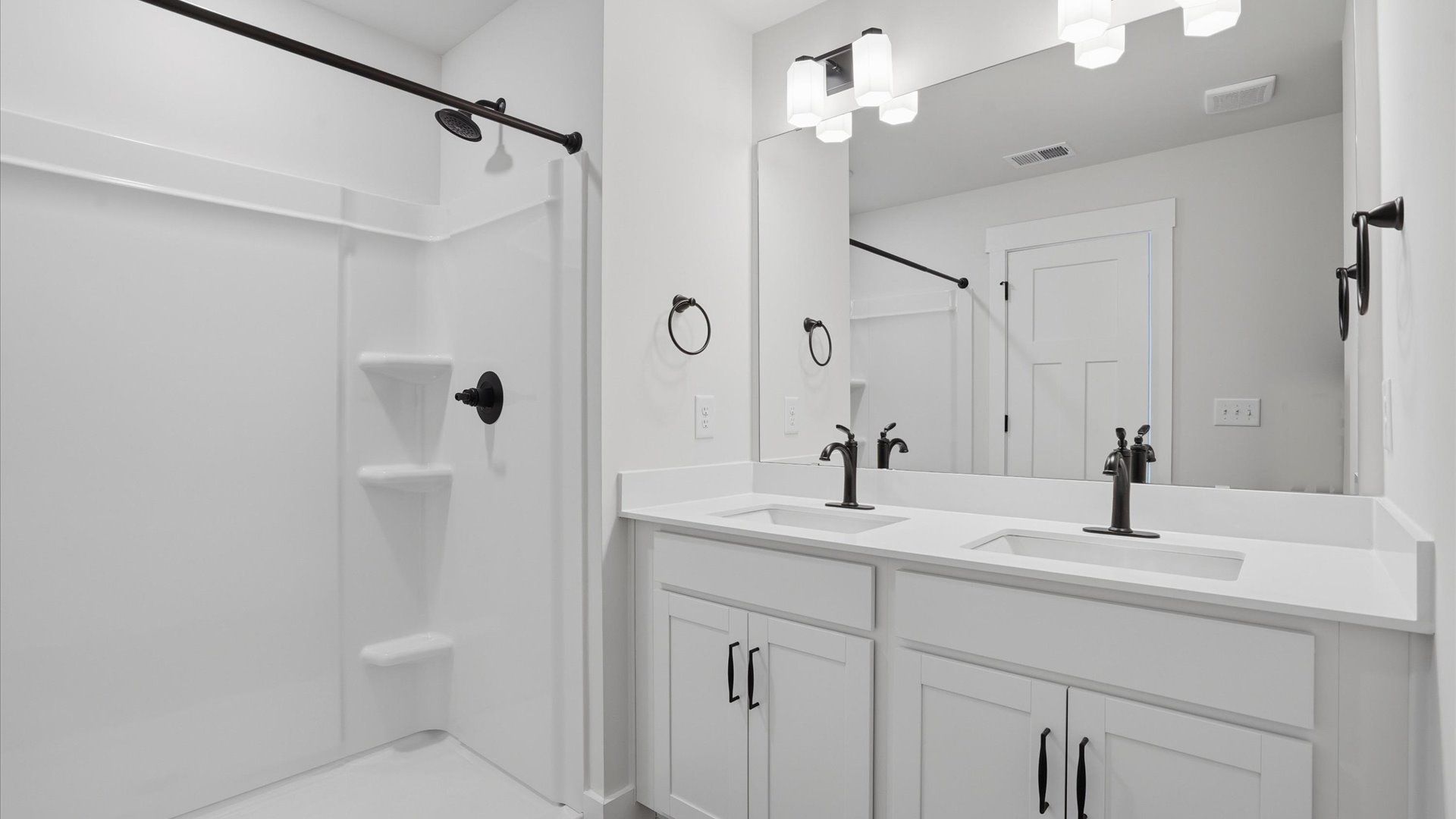 Elegant bath retreat with designer finishes and a clean, timeless aesthetic at Harrier Point