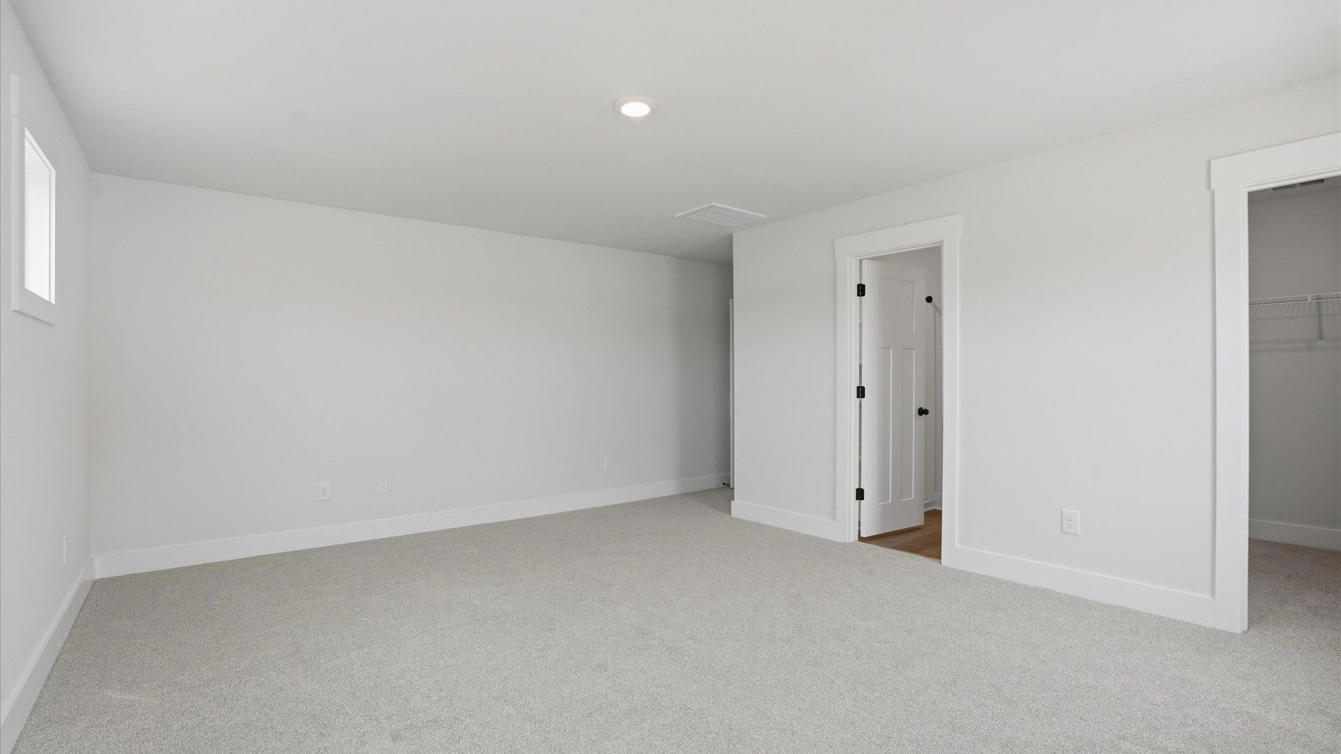 Vibrant and restful bedroom with oversized windows, refined detail, and a warm, welcoming atmosphere in Woodruff, SC