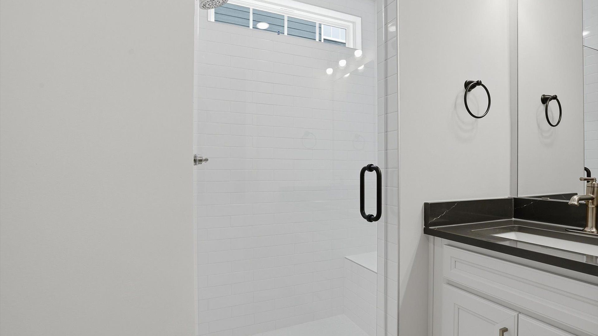 Superior en-suite primary bathroom with stylish walk-in shower—crafted with high standards in mind