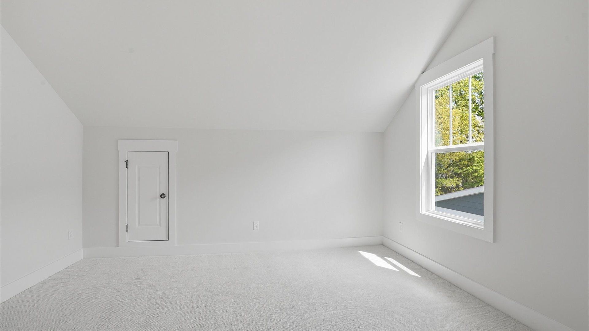 Functional space offering plush carpet underfoot and a thoughtfully planned walk-in closet