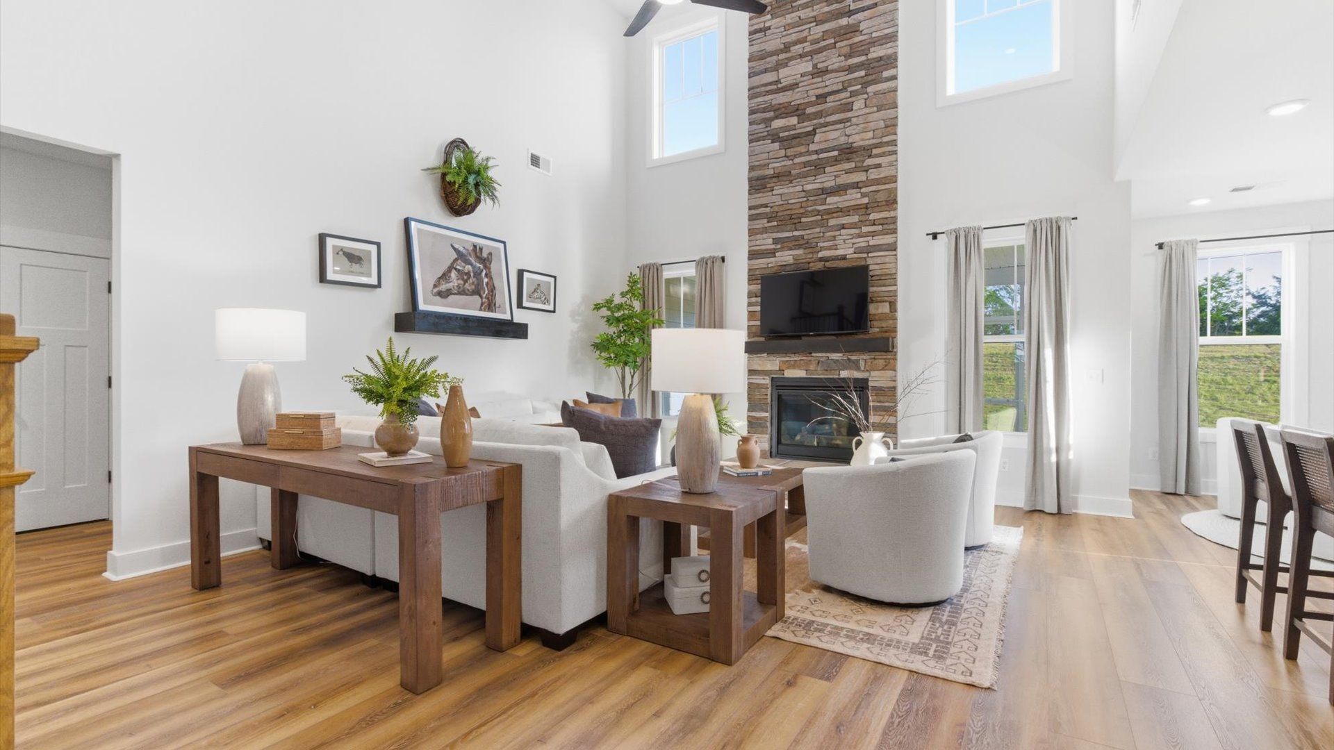 Spacious and stylish family room with two-story ceilings that create a bright and open atmosphere in Woodruff, SC