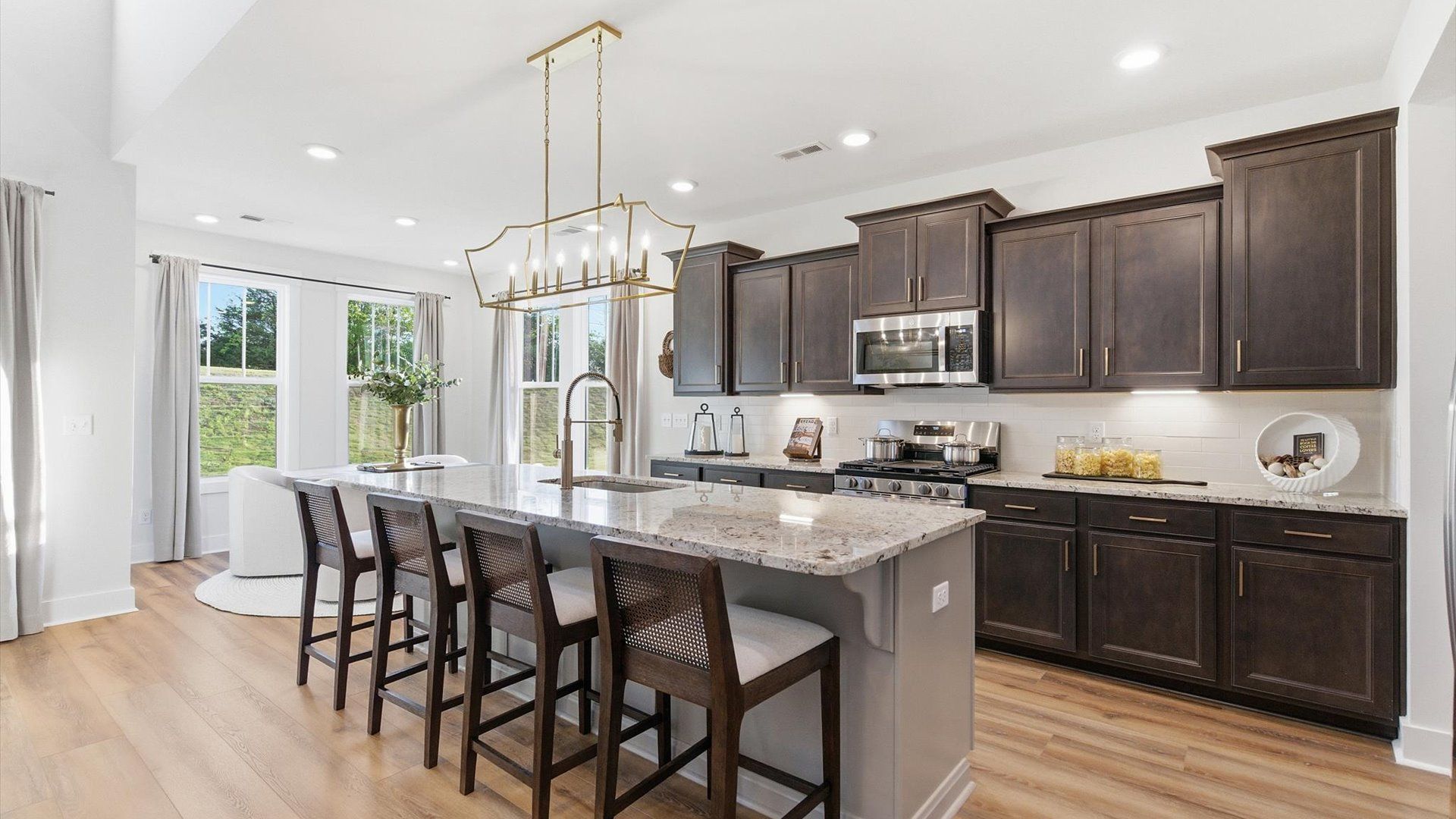 Exceptional kitchen featuring a spacious island, eye-catching pendant lights, and modern finishes located in Woodruff, SC