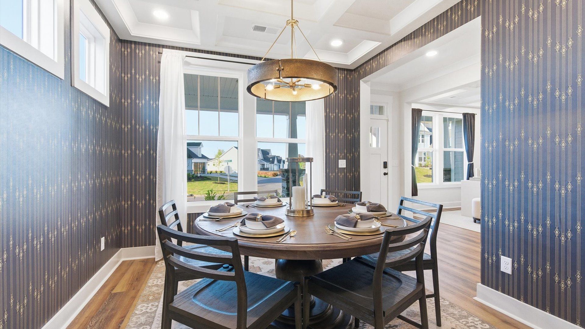 Established charm meets modern elegance in this first-rate dining room by DRB Homes in Woodruff, SC
