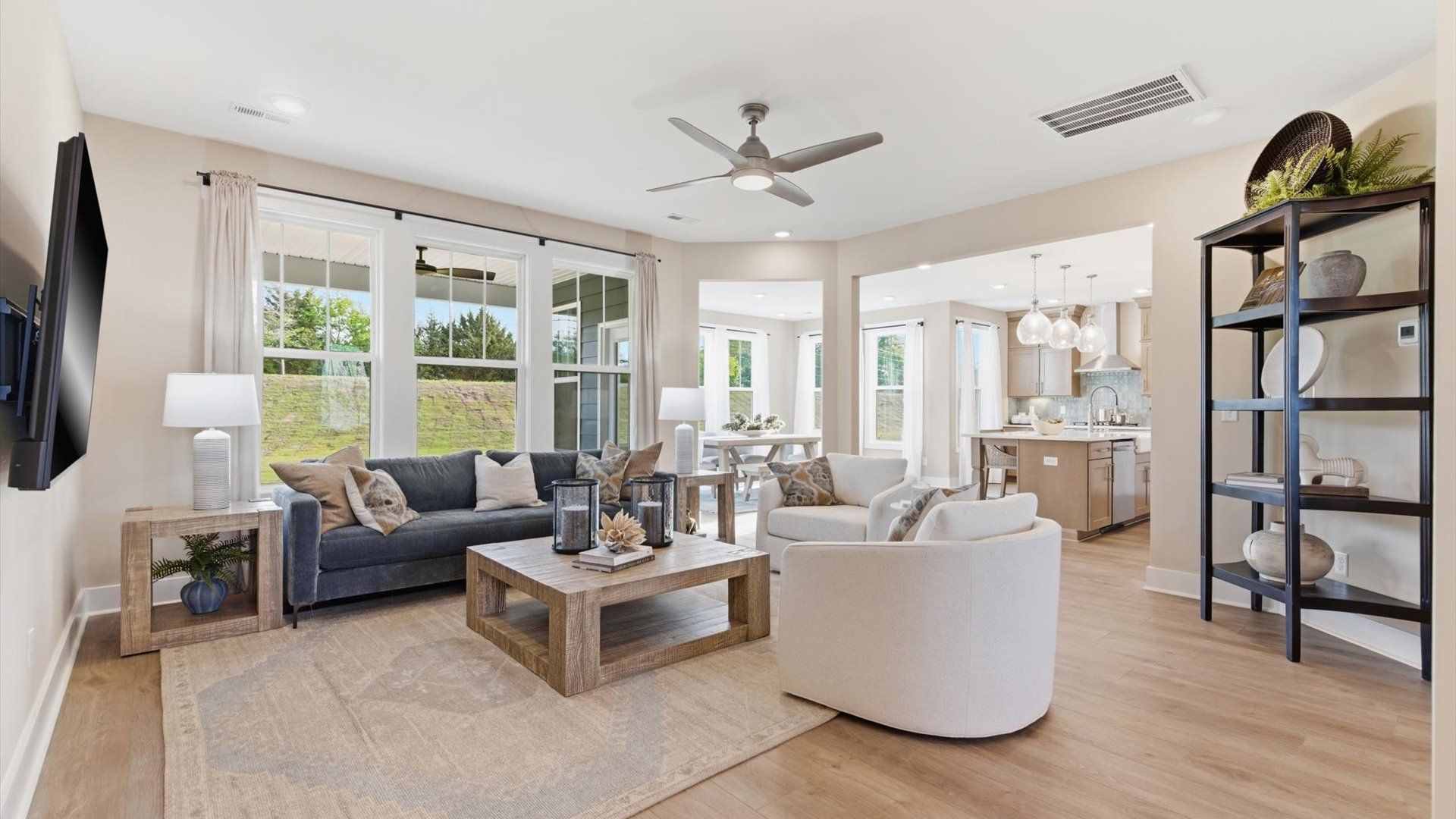 Exceptional family space with hardwood floors and seamless flow to dining and kitchen areas at Benjamin's Grove