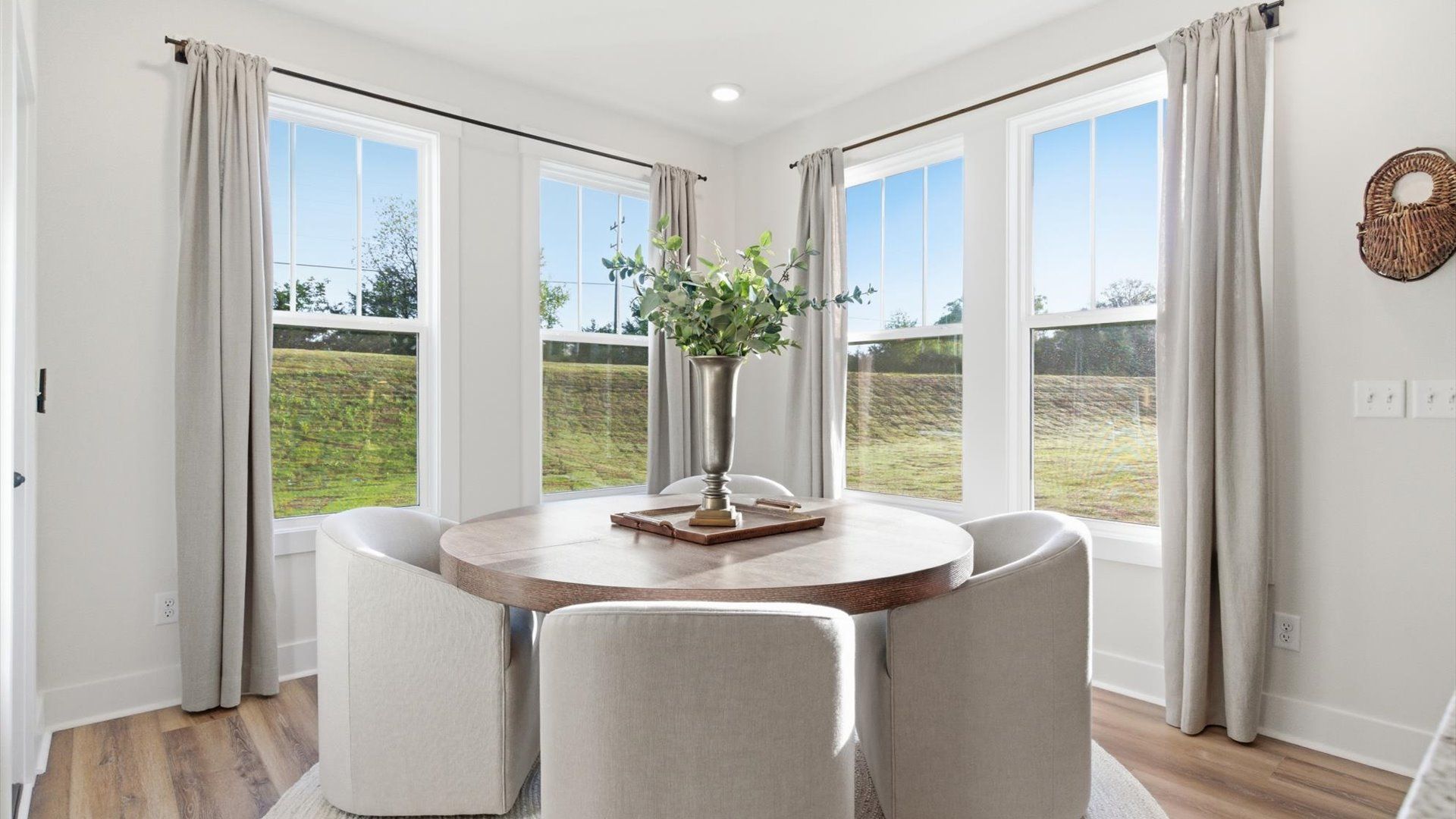 Notable breakfast area with high standards and elegant millwork in this accomplished home at Benjamin's Grove