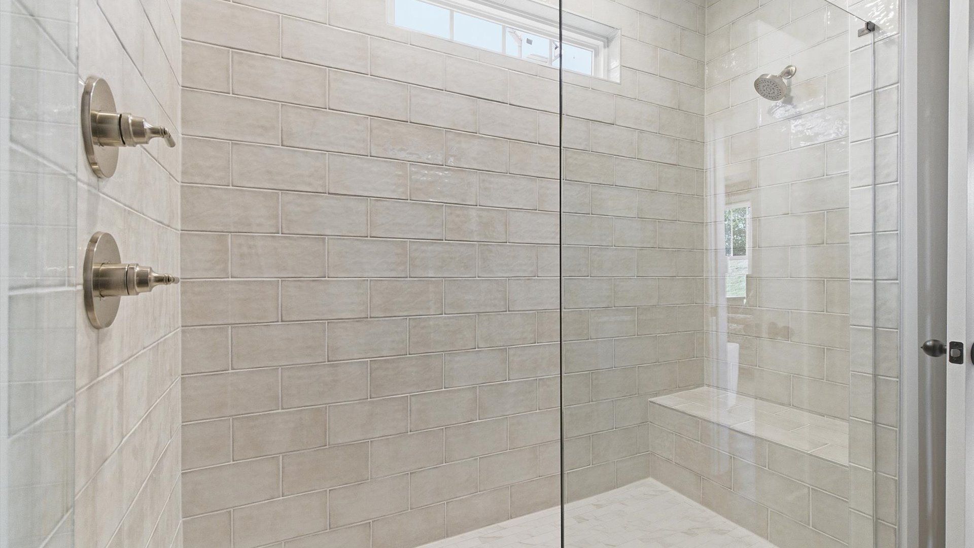 Accomplished design shines in this primary bath with a sleek walk-in shower and refined finishes in Woodruff, SC