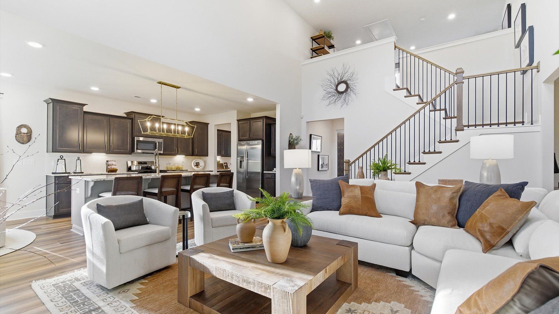 Notable two-story family room offering a grand yet inviting space for memorable everyday living in Woodruff, SC