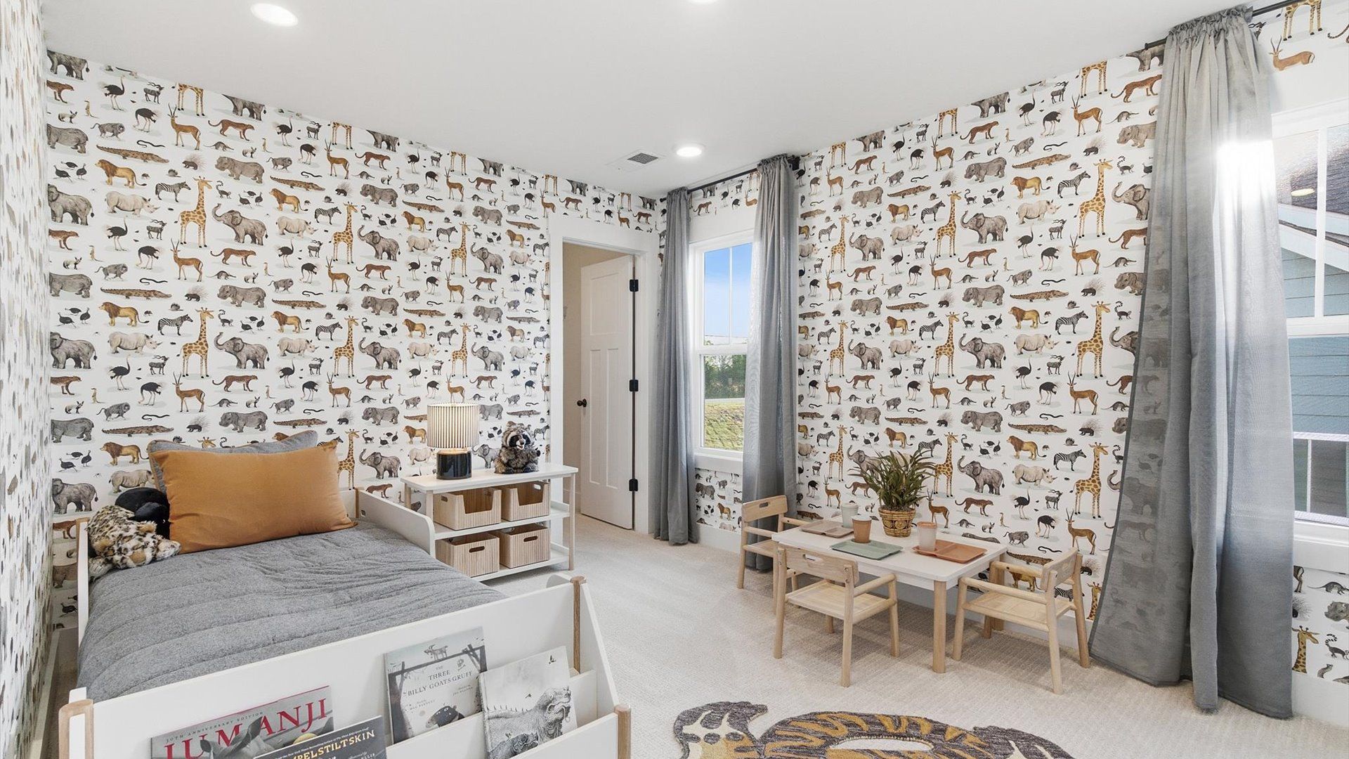 Inviting bedroom with tasteful finishes and large windows that create a fresh, open ambiance located in Woodruff, SC