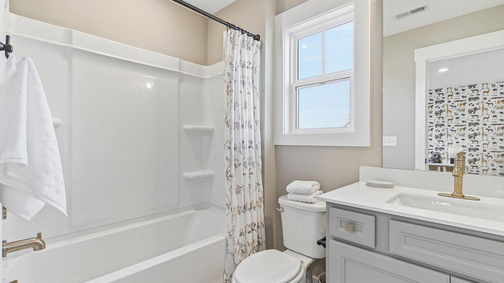 Top-notch bathroom with current fixtures, tasteful materials, and elevated charm at the Benjamin's Grove community