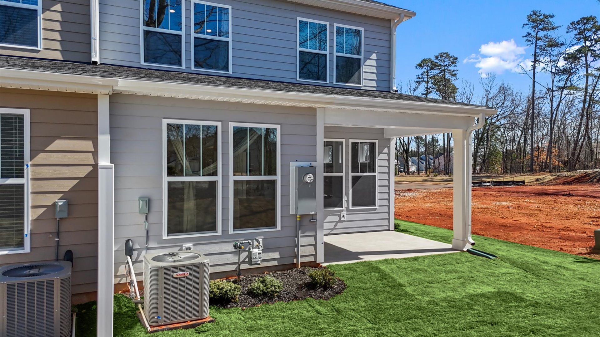 Rear covered porch of the Lawson floorplan creates a seamless extension of this home’s elegant design in Greenville, SC