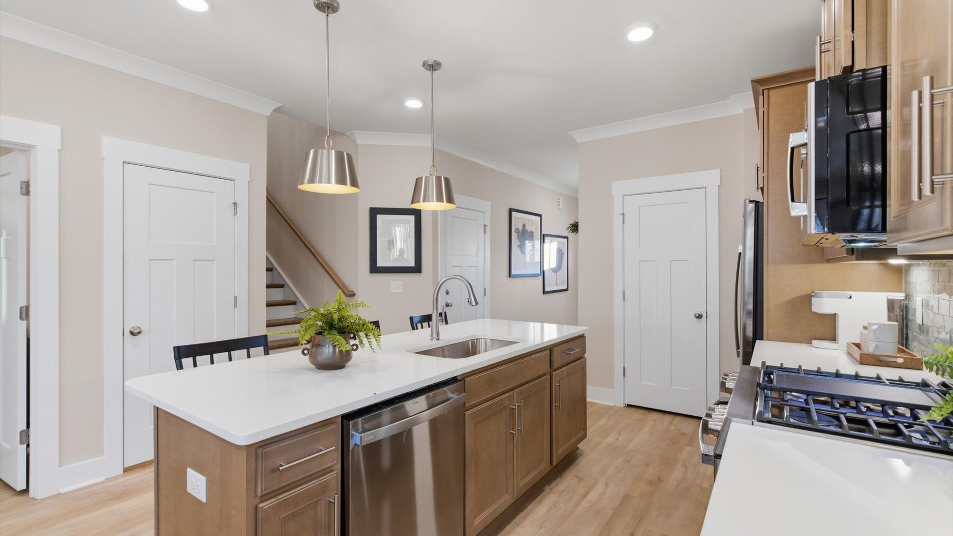 Exclusive DRB Homes kitchen with a 9-foot island and elevated finishes in a prime location at Pelham Crossing