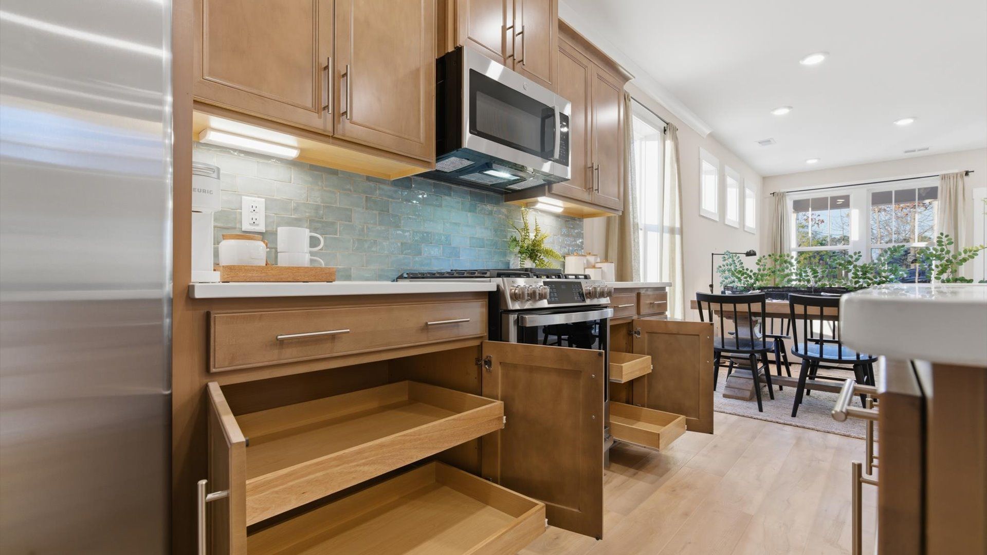 Highly skilled craftsmanship shines in this modern kitchen with superior cabinetry and quartz countertops in Greenville, SC