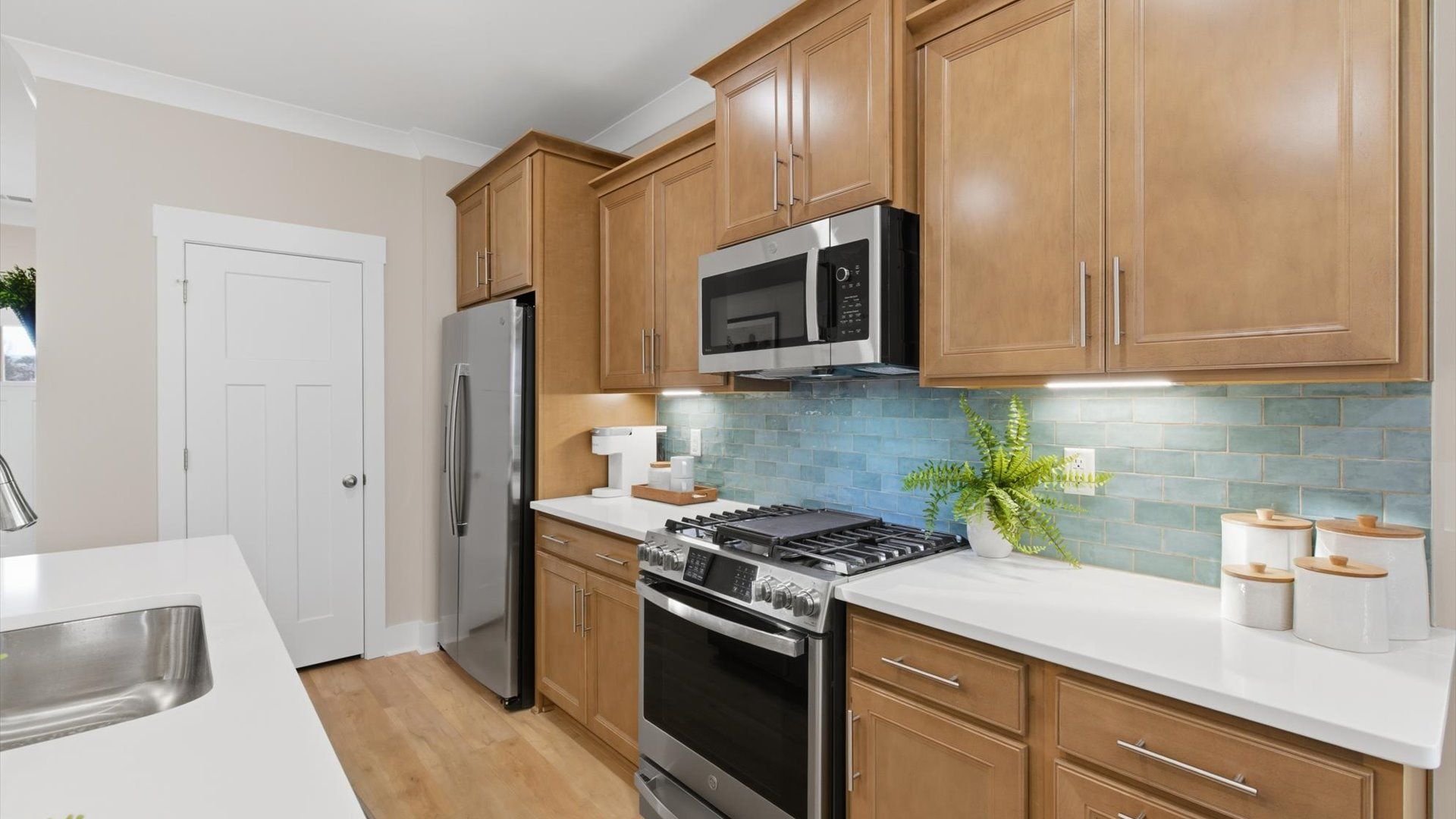 Beautifully appointed kitchen with spacious counters and sophisticated detailing located at Pelham Crossing Villas