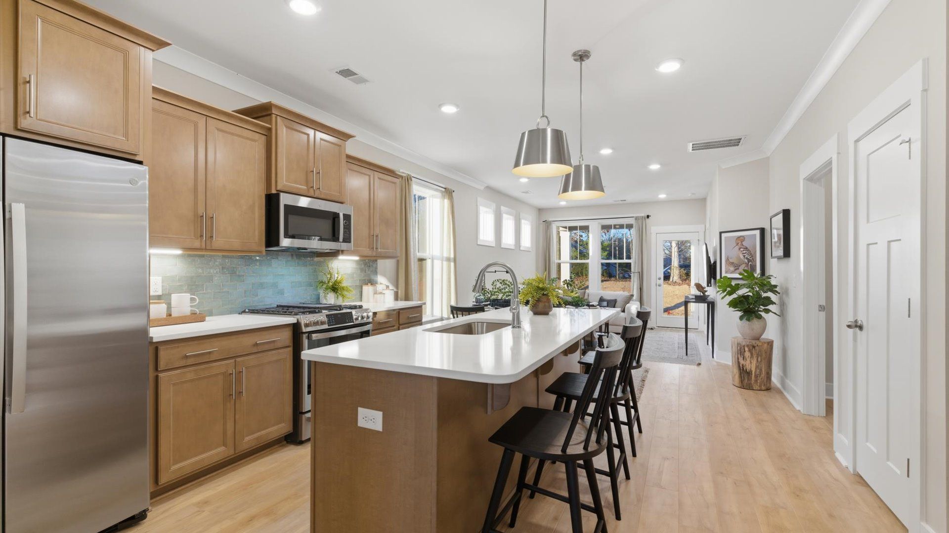 Memorable meals begin in this vibrant kitchen with pendant lighting and a thoughtfully designed island in Greenville, SC