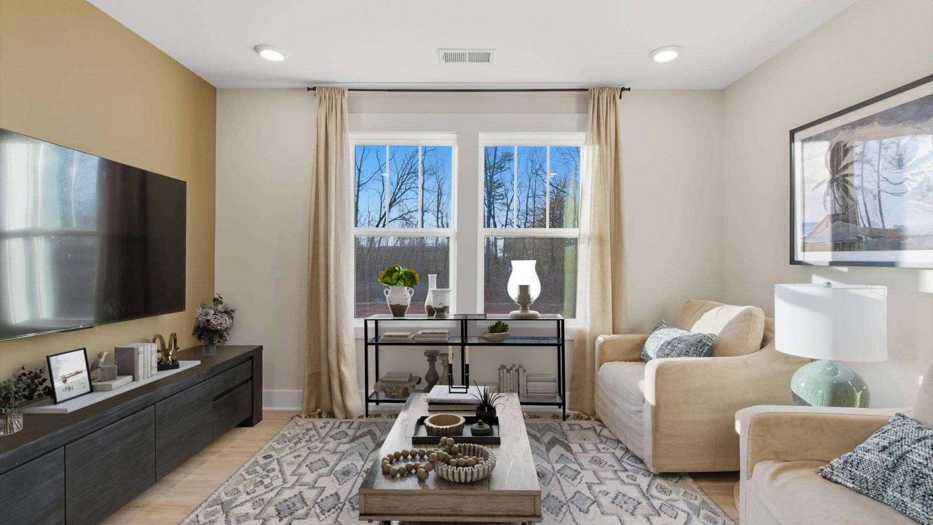 Functional loft with tasteful hardwood floors and exceptional natural light in a modern villa at Pelham Crossing Villas