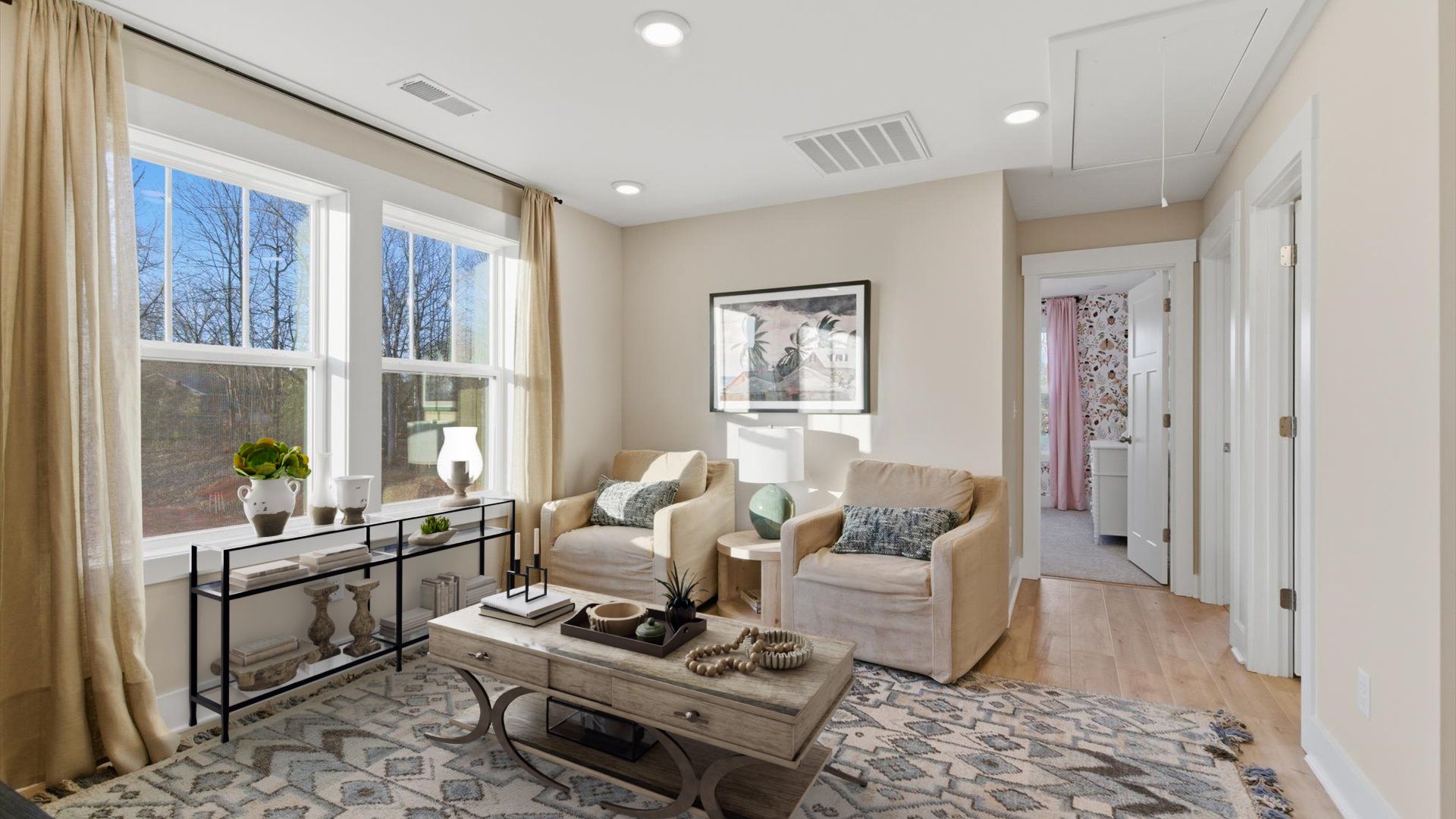 Hardwood flooring enhances the versatility of this elegant upper-level loft space located in Greenville, SC