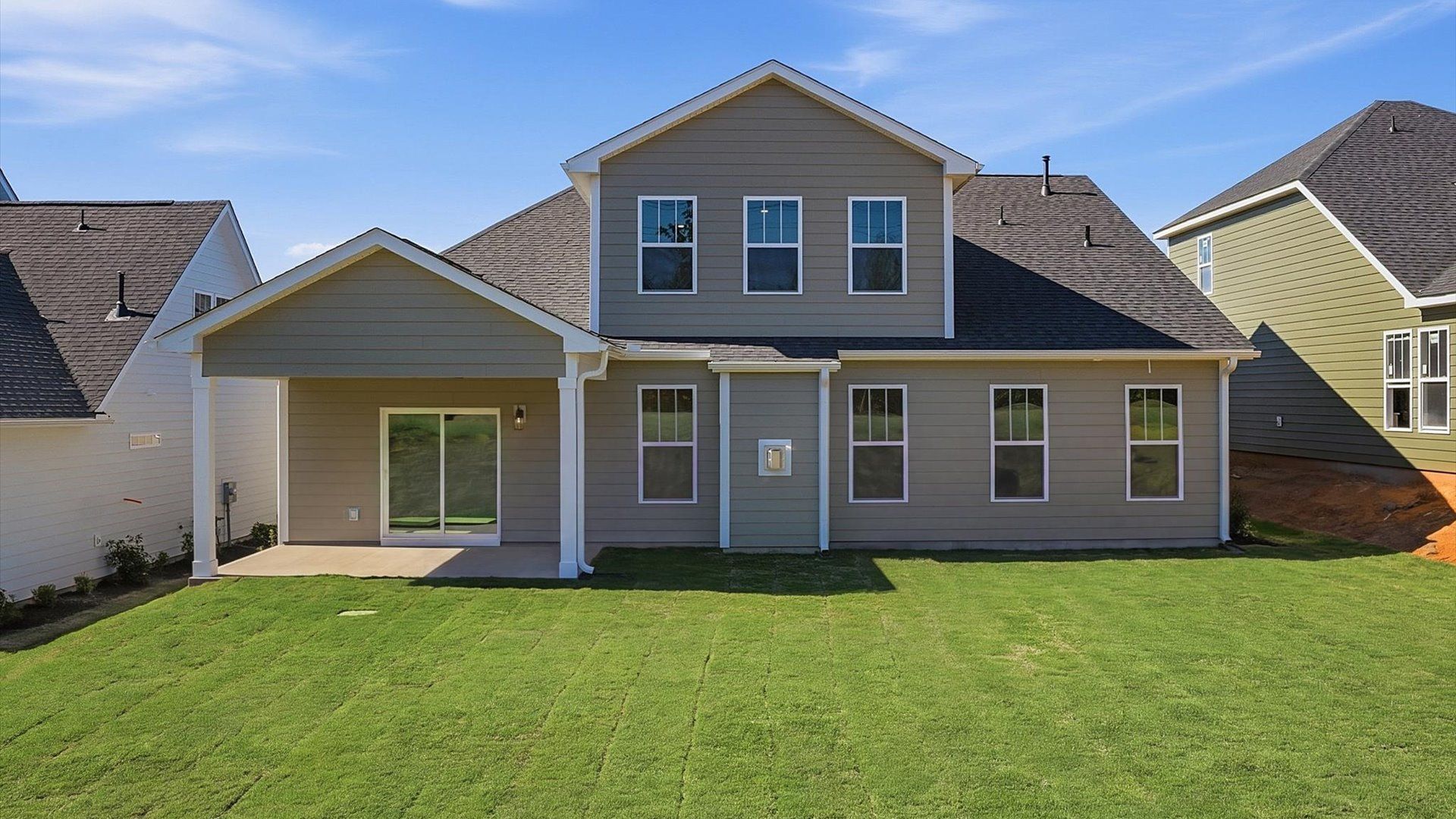 Exclusive rear exterior featuring a covered porch with accomplished detail and elevated outdoor living potential in SC