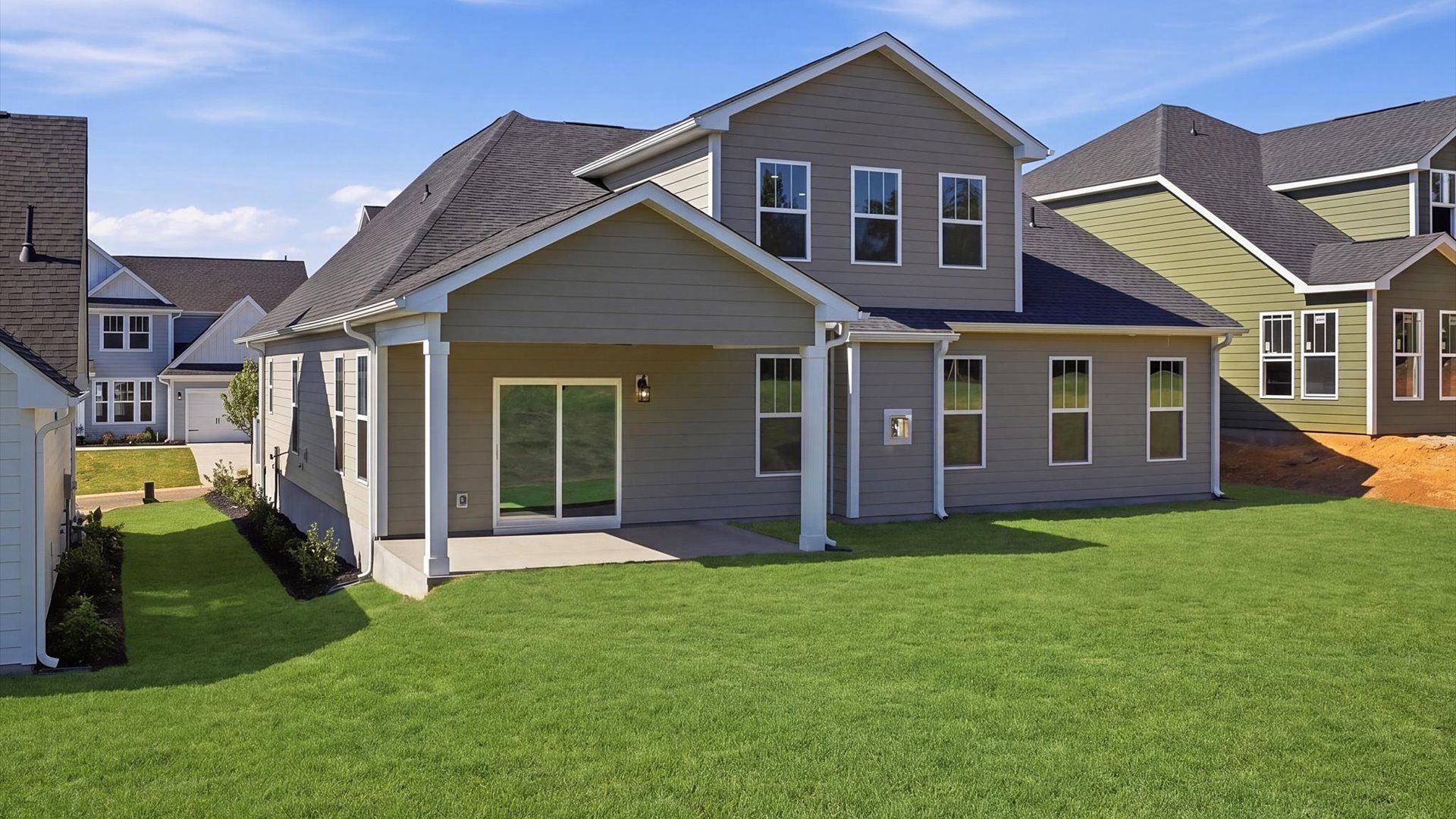 Refined rear exterior with a stylish covered porch for dining, relaxing, or entertaining located at Benjamin's Grove