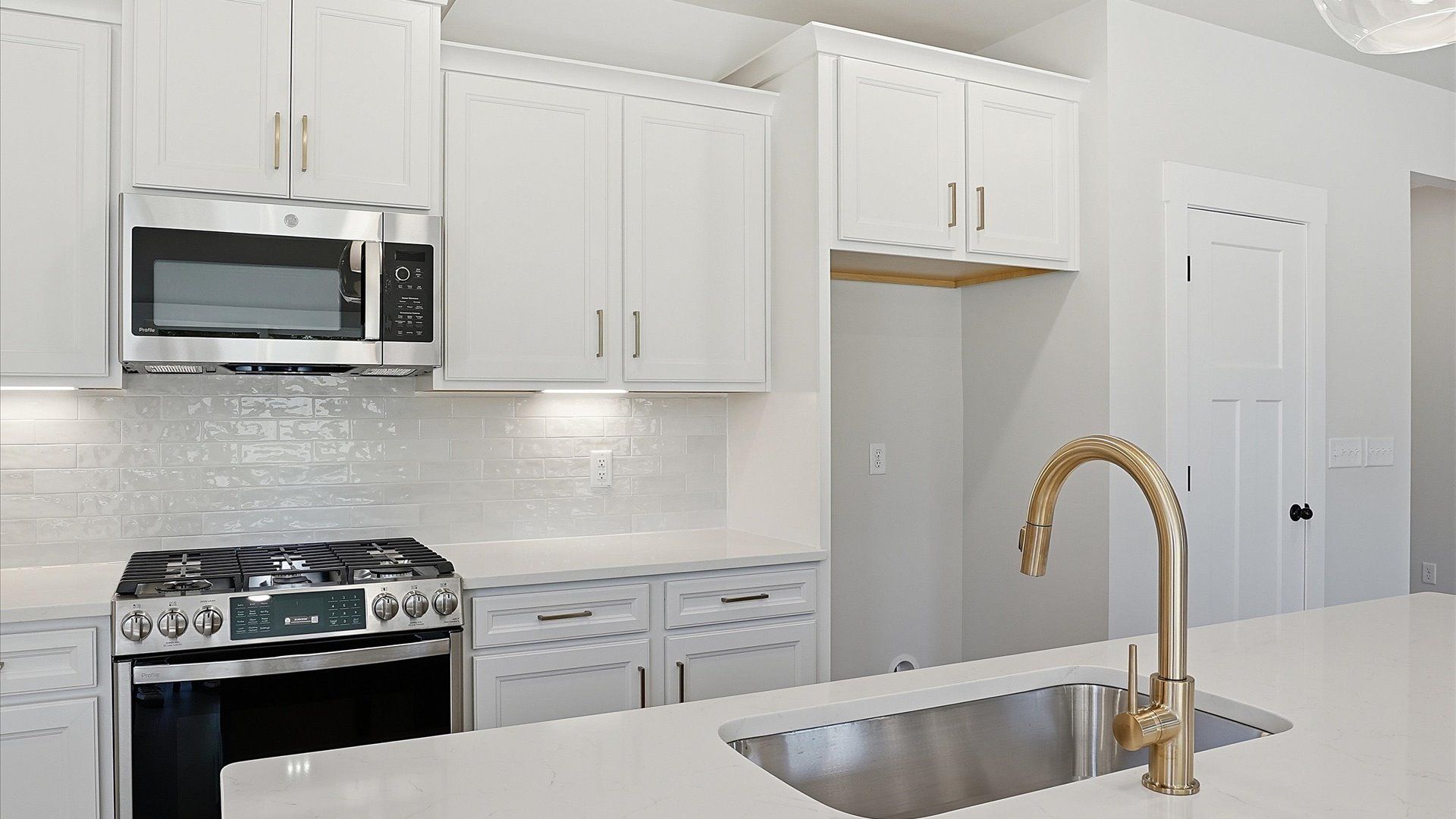 Elegant kitchen with modern finishes in this first-class home at Benjamin's Grove in Woodruff, SC
