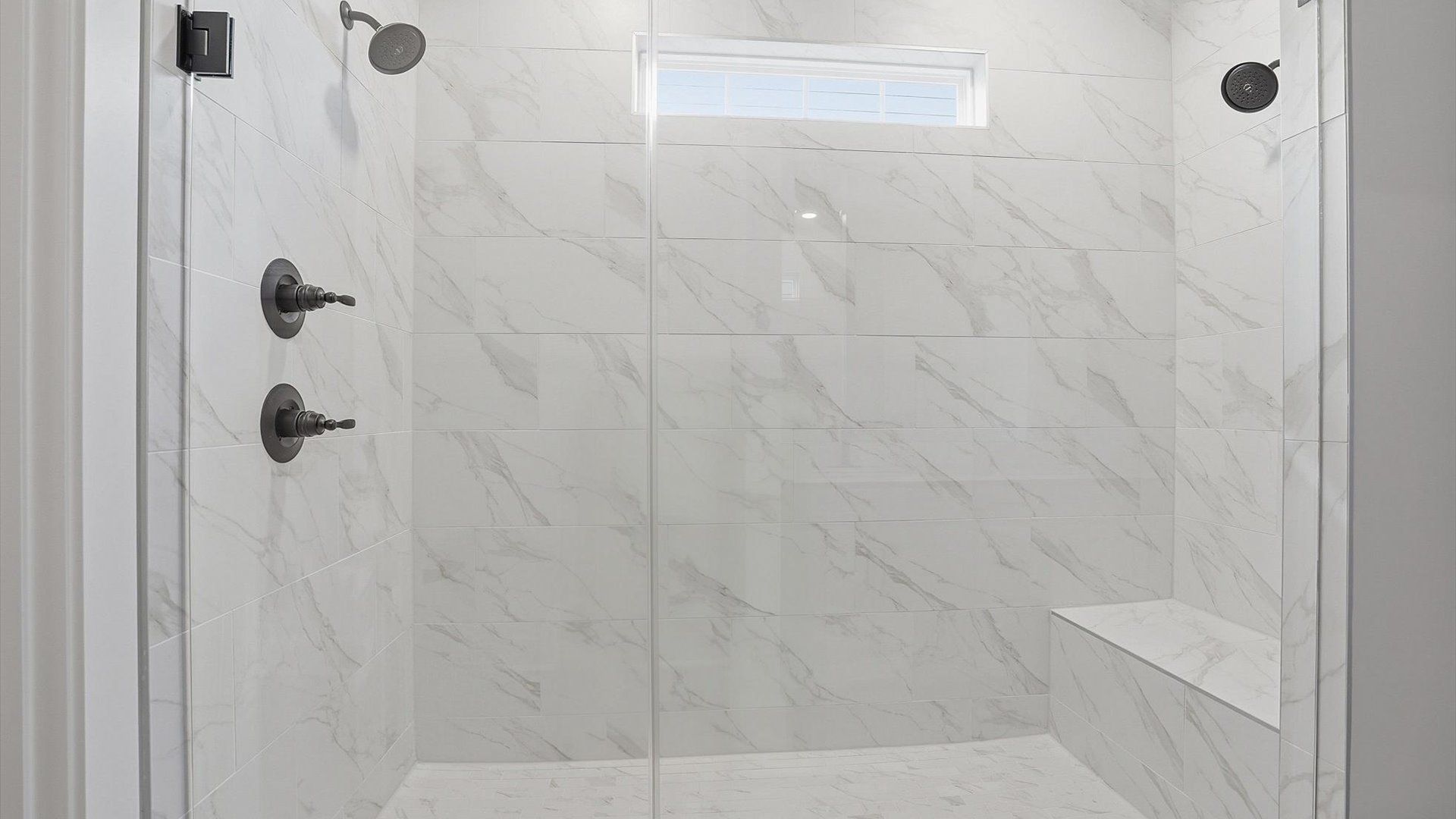 Memorable mornings begin in this elegant primary bathroom with walk-in shower and premium fixtures located in Woodruff, SC