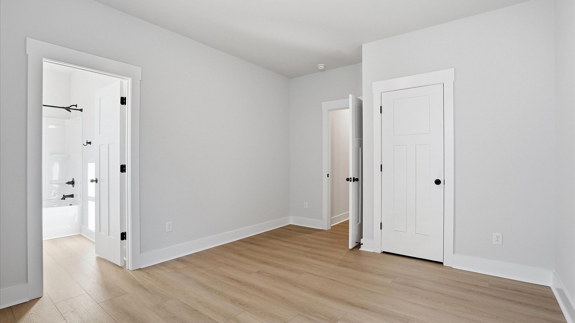 First-rate secondary bedroom with a spacious walk-in closet and elegant hardwood flooring located in Woodruff, SC