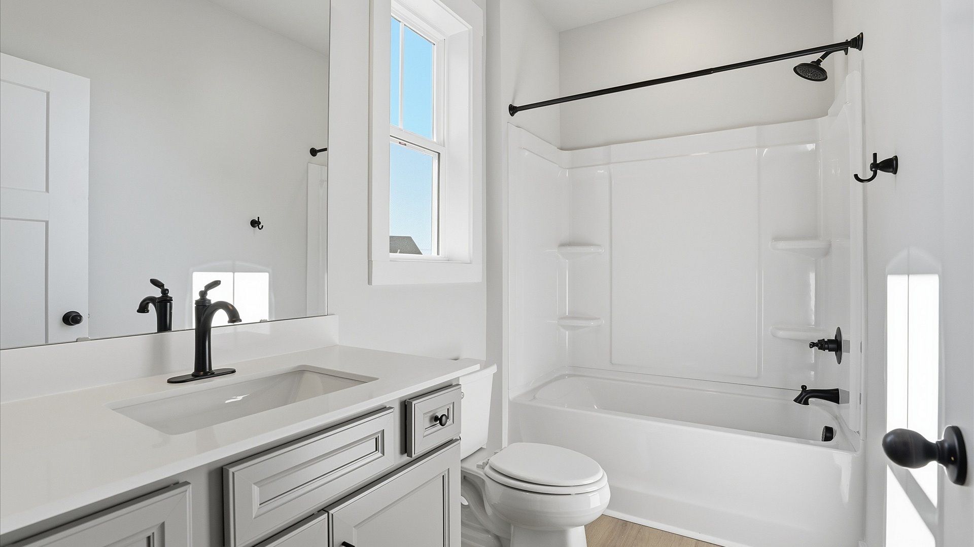 Vibrant and welcoming bathroom with elegant countertop space and polished details at Benjamin's Grove