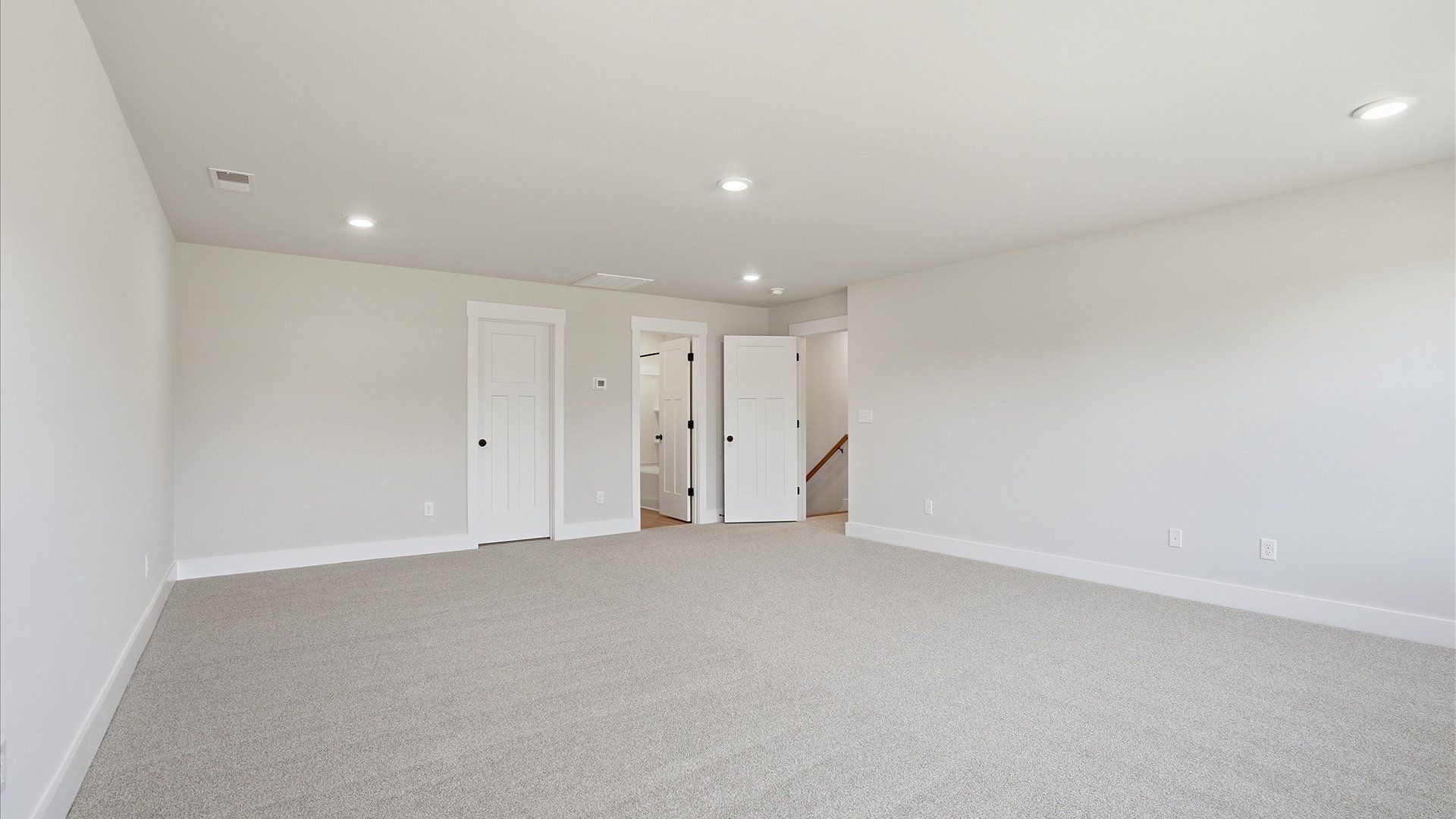 Memorable upstairs room with plush carpeting and a bright, welcoming atmosphere