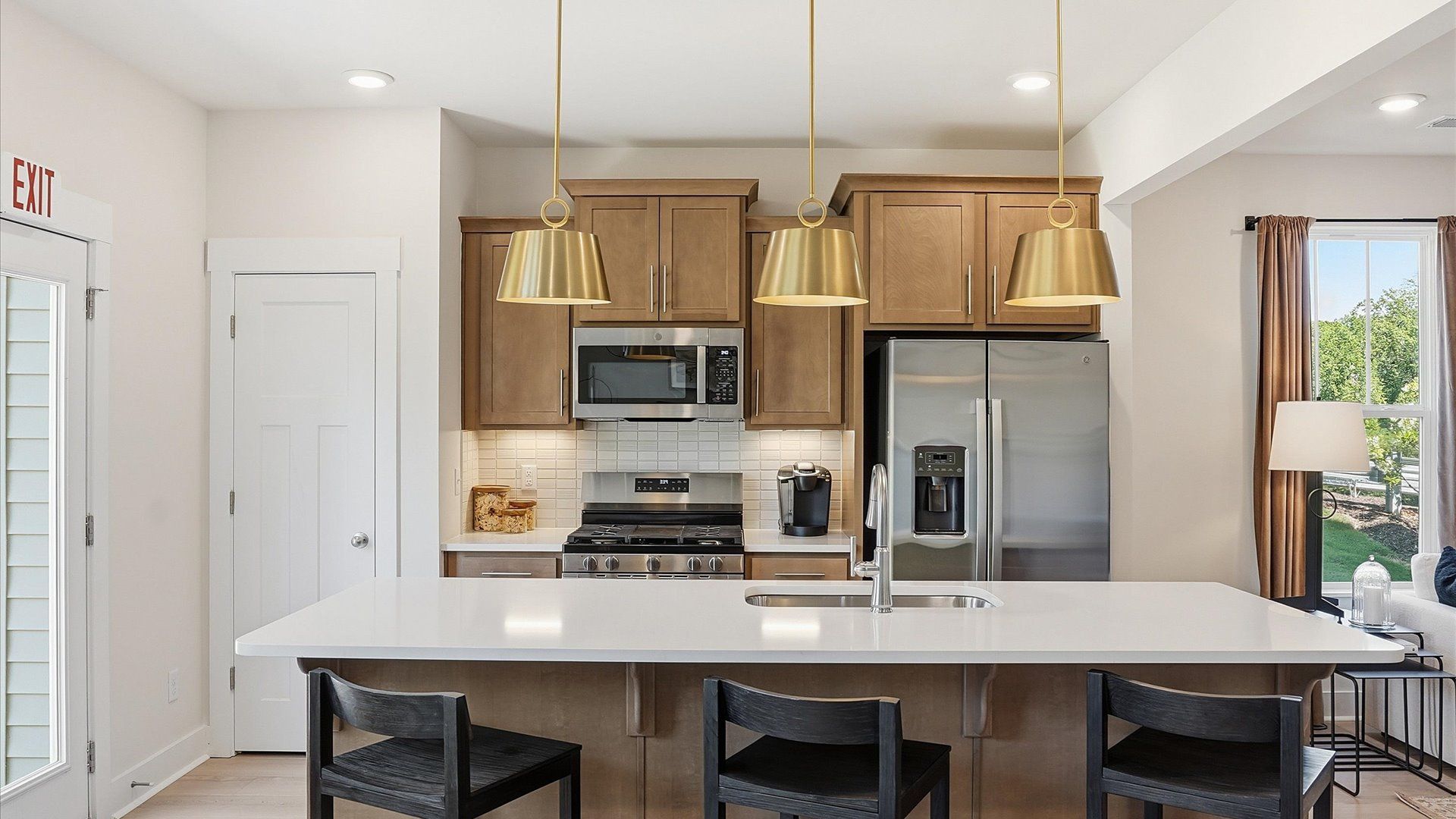 Vibrant kitchen layout with a center island, refined finishes, and open-concept flow at El Dorado
