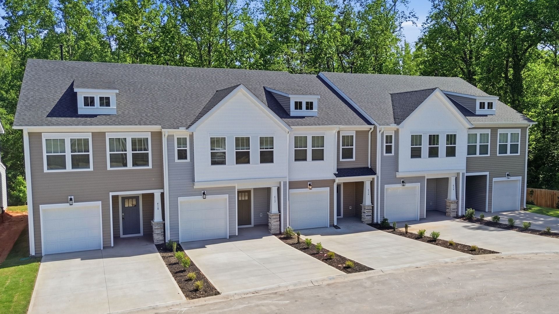Eye-catching exterior with timeless color palette and superior architectural detail on these townhomes at El Dorado