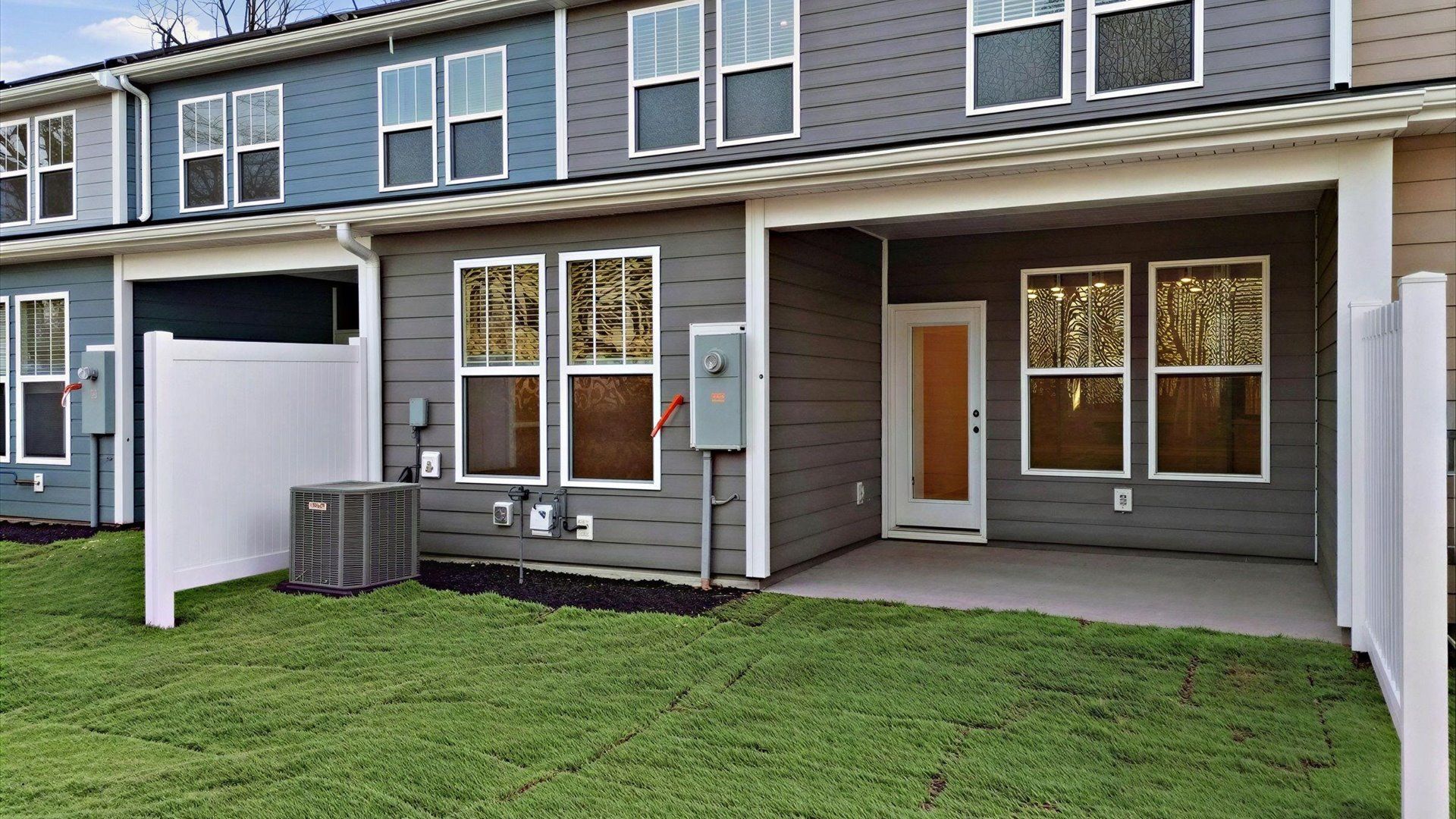 Superior curb appeal continues to the back with a refined, covered outdoor living space