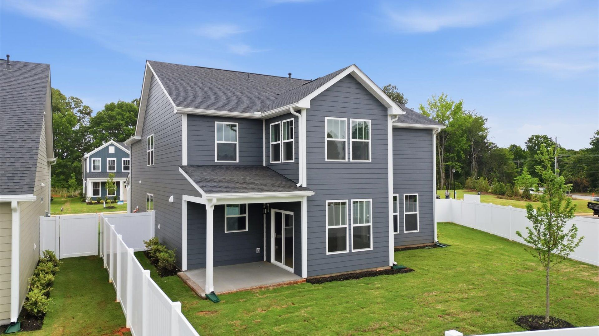 Highly functional rear covered porch adds memorable living space to this elegant single family home in Greenville, SC