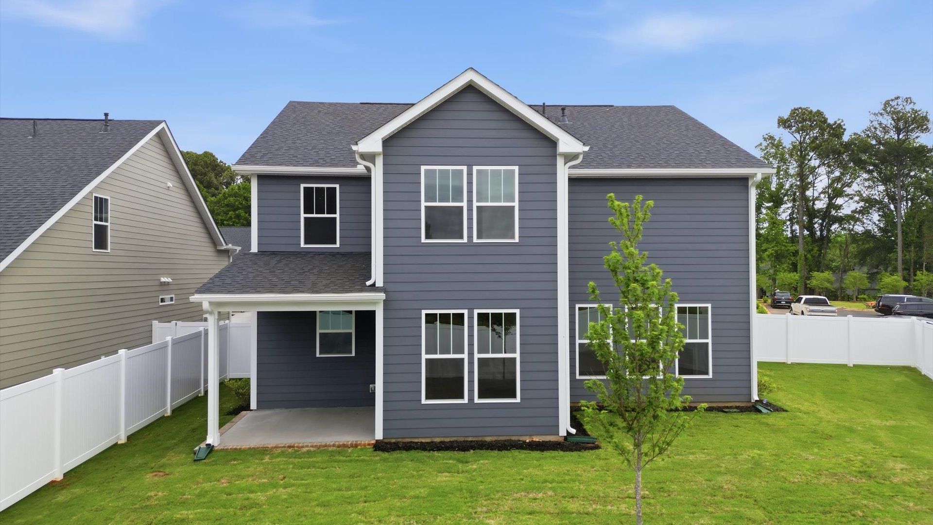 Exceptional outdoor living begins with a covered back porch in this thoughtfully designed home located in Greenville, SC