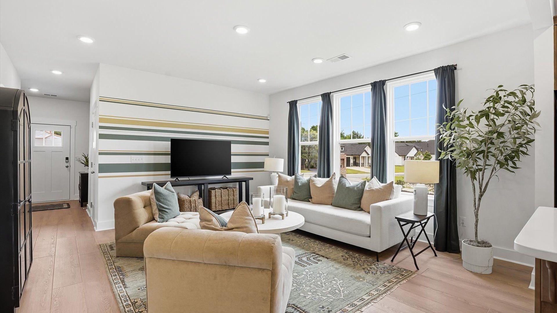 Exceptional family space with hardwood floors and seamless flow to dining and kitchen areas at Anna's Pointe