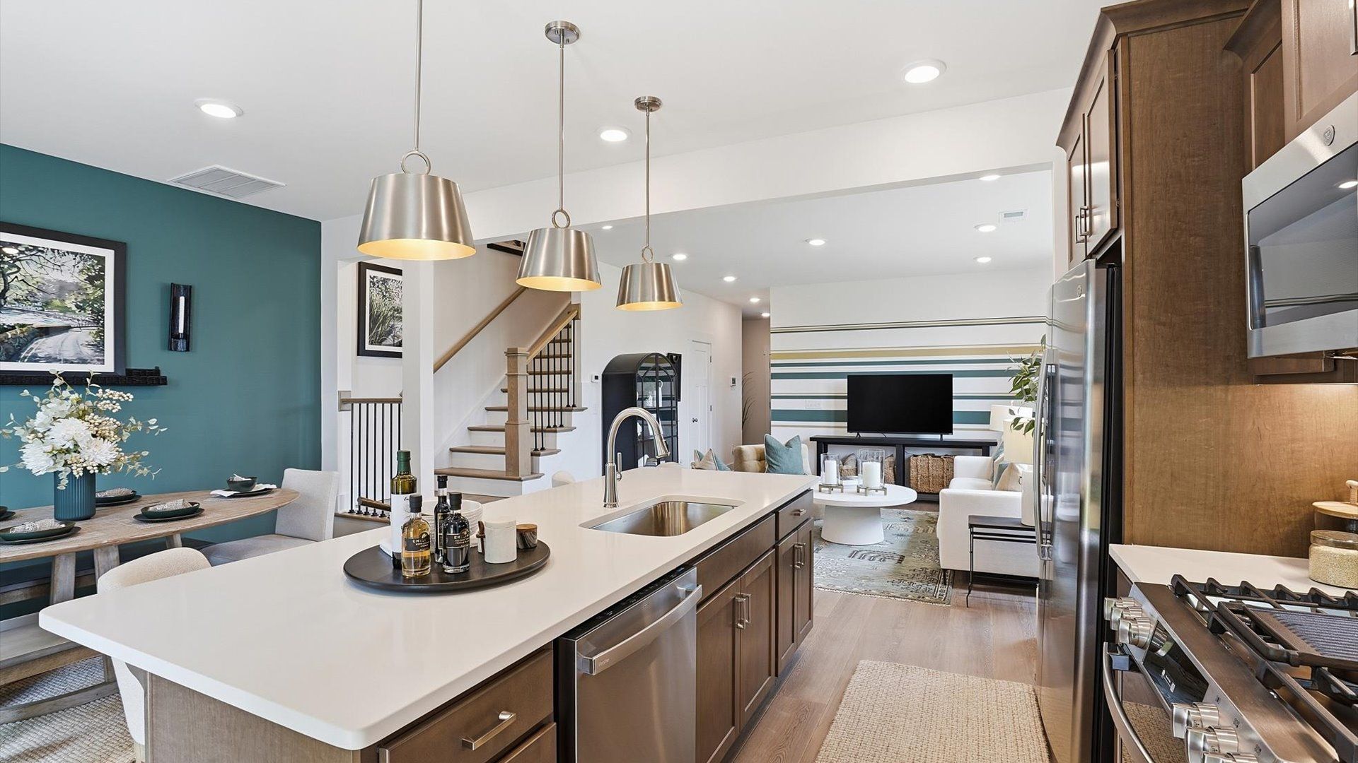 Exceptional kitchen featuring a spacious island, eye-catching pendant lights, and modern finishes in Simpsonville, SC