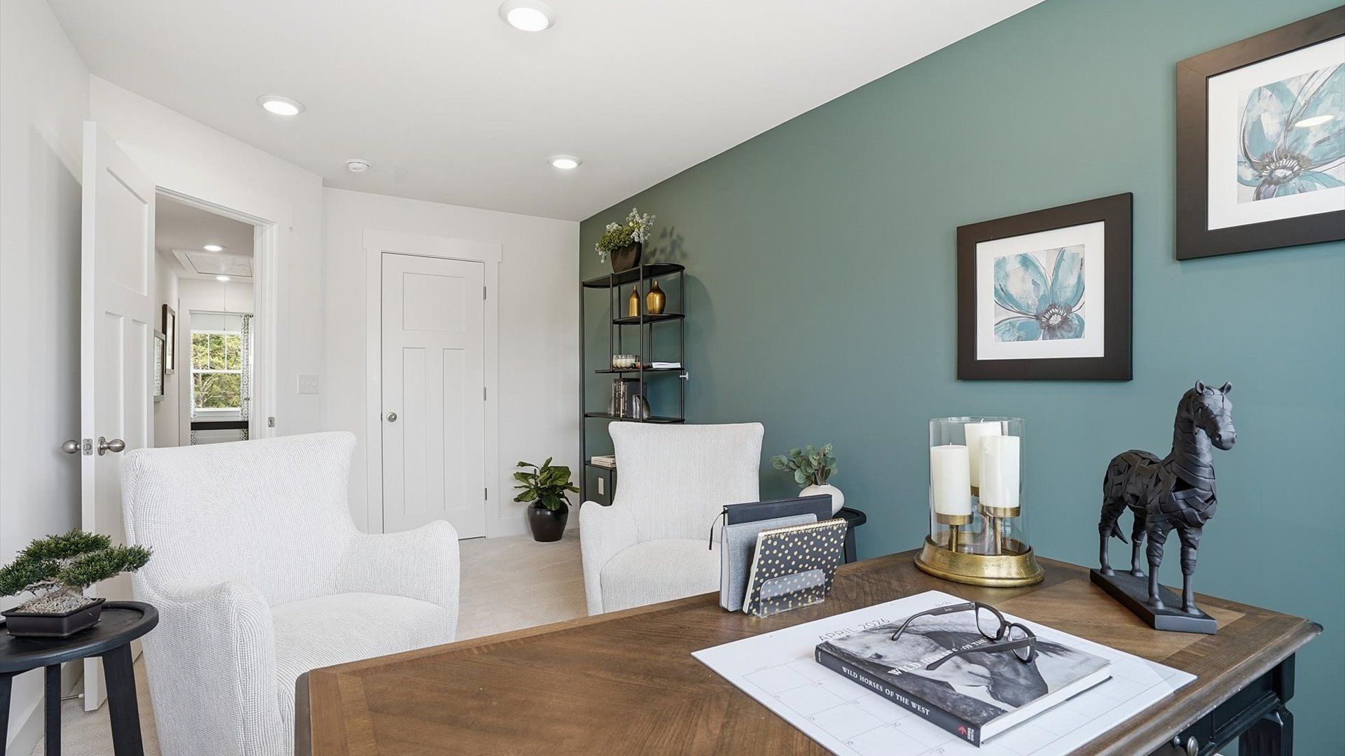 Highly functional bedroom with large windows, carpeted flooring, and tasteful finishes throughout